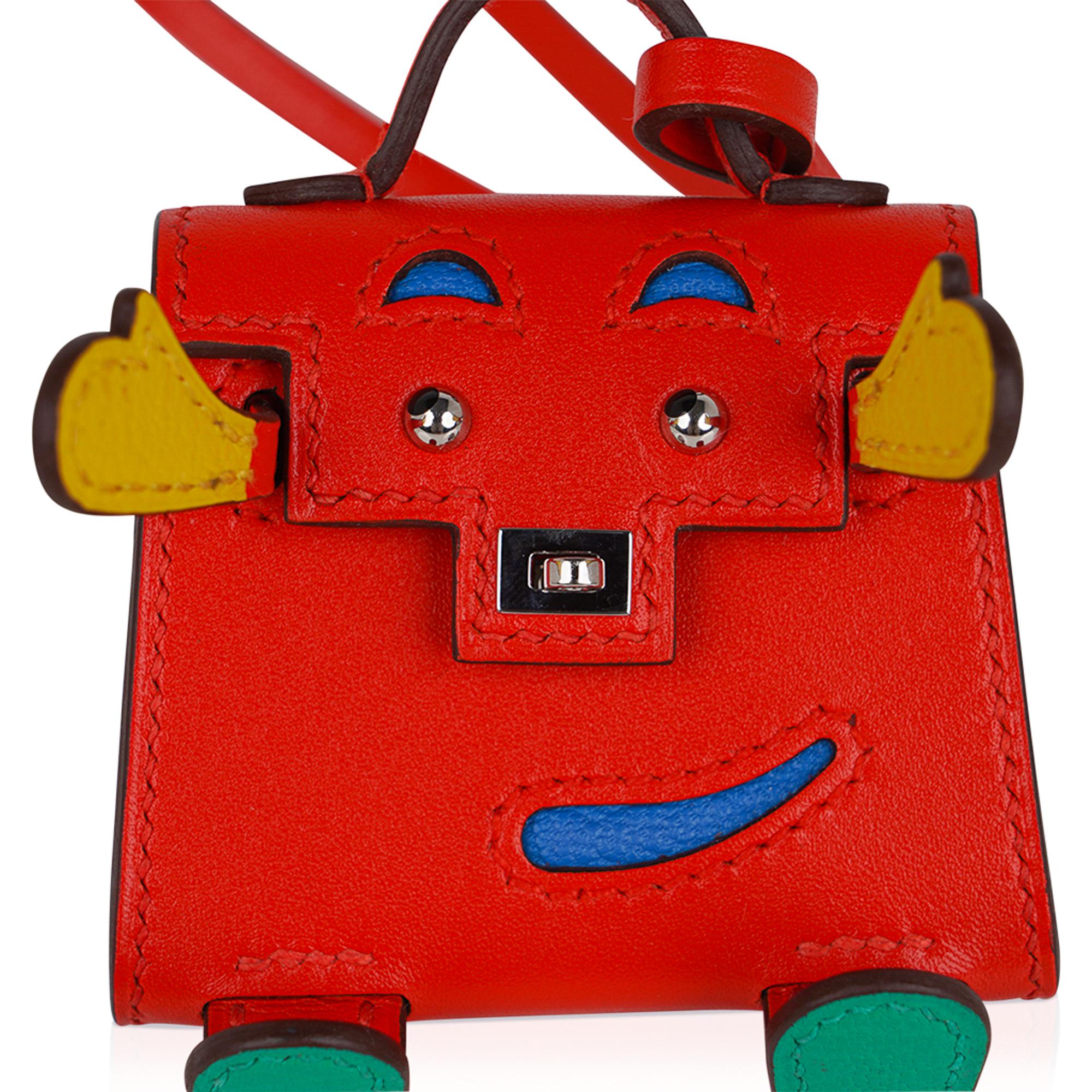 Mightychic offers a very rare limited edition Hermes Kelly Idole bag charm featured in  Capucine, Jaune de Naples, Vert Vertigo and Blue Zanzibar.
Bright and fun in Tadelakt leather.
Whimsical and delightful this fabulous charm has a turn lock that