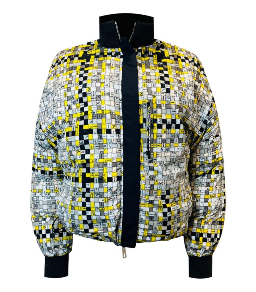 Hermes Quilted Reversible Bomber Jacket

Black bomber which can be worn plain or reverse showing Hermes checked pattern

with logos. Leather accents, silver Hermes logo zipper pull closure and press stud to collar.

Zipper pockets. Virgin wool cuffs