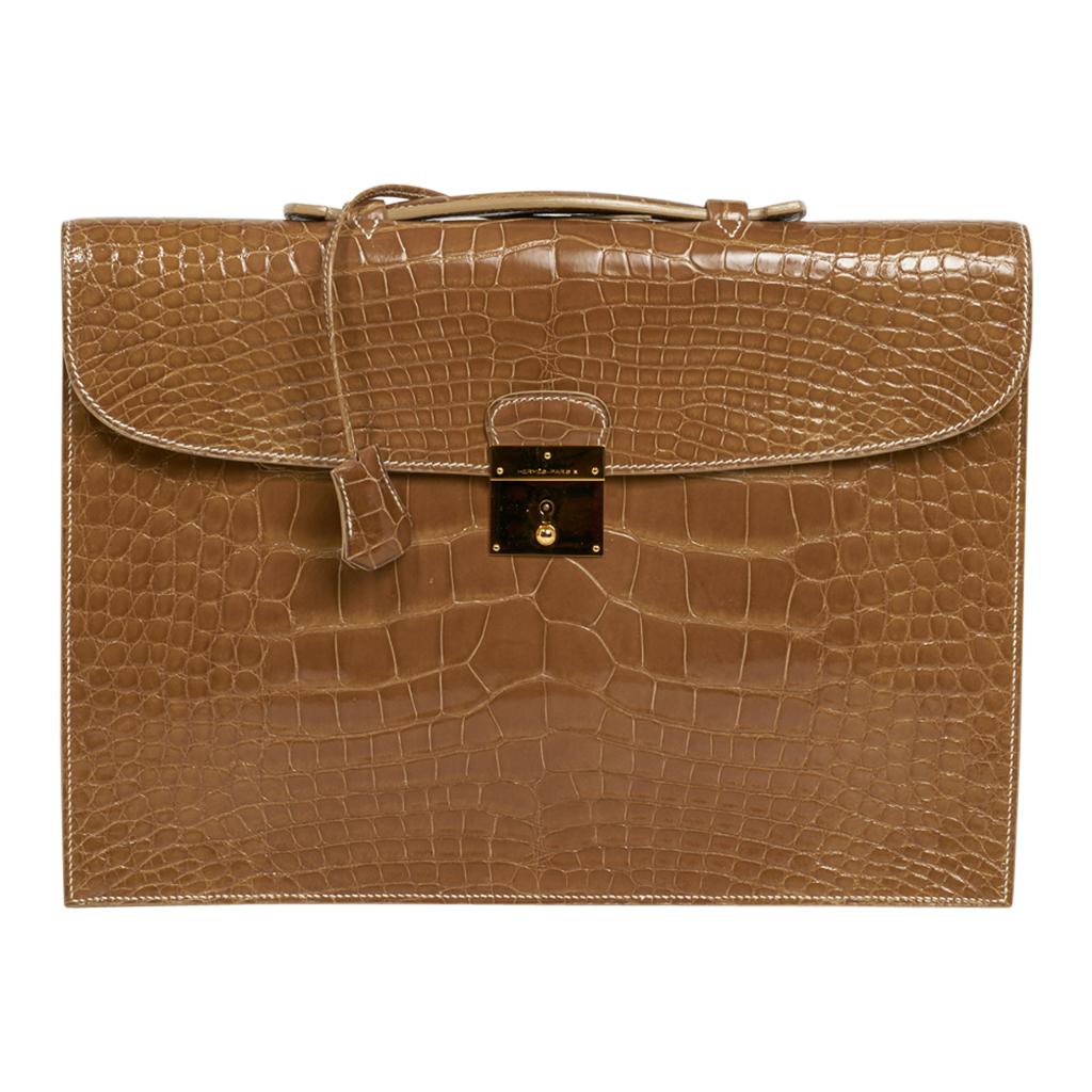 Mightychic offers an Hermes Quirus briefcase / portfolio feature in Ficelle alligator.
Gold hardware.
Very minor marks on hardware.
Comes with keys and clochette, signature Hermes box and sleeper.
Final sale

BRIEFCASE MEASURES:
LENGTH 