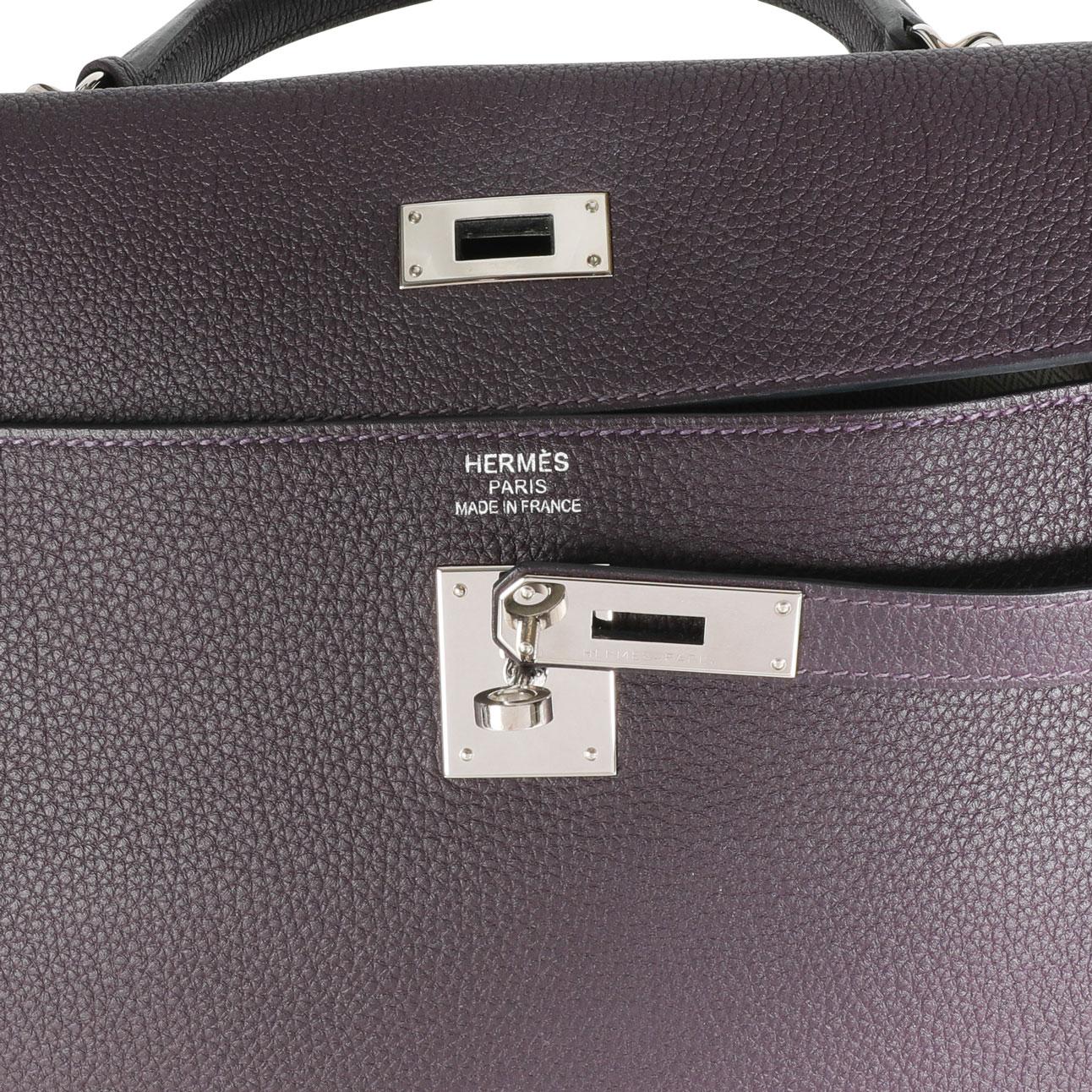  Hermès Raisin Togo Kelly Retourne 35 PHW
SKU: 111993
MSRP:  
Condition: Pre-owned (3000)
Condition Description: 
Handbag Condition: Very Good
Condition Comments: Very Good Condition. Plastic on some hardware. Faint marks to exterior. Light scuffing