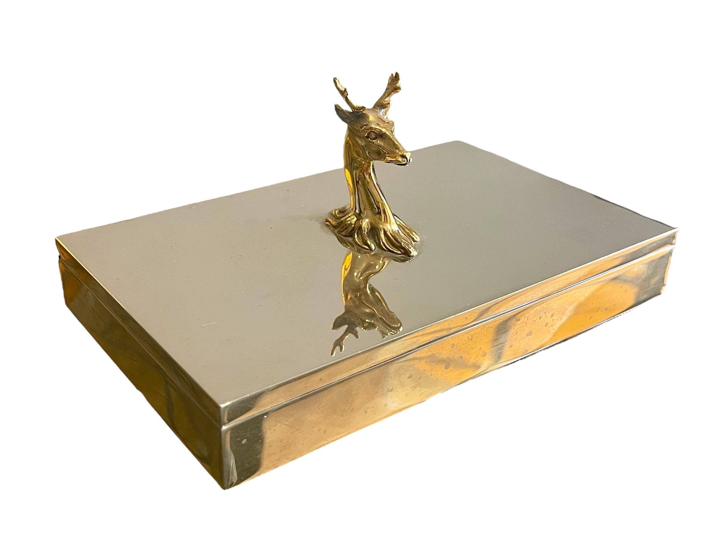 Rare silver-plated cigarette box with a gilt-plated deer head opening. It is in good condition and is signed on the side 