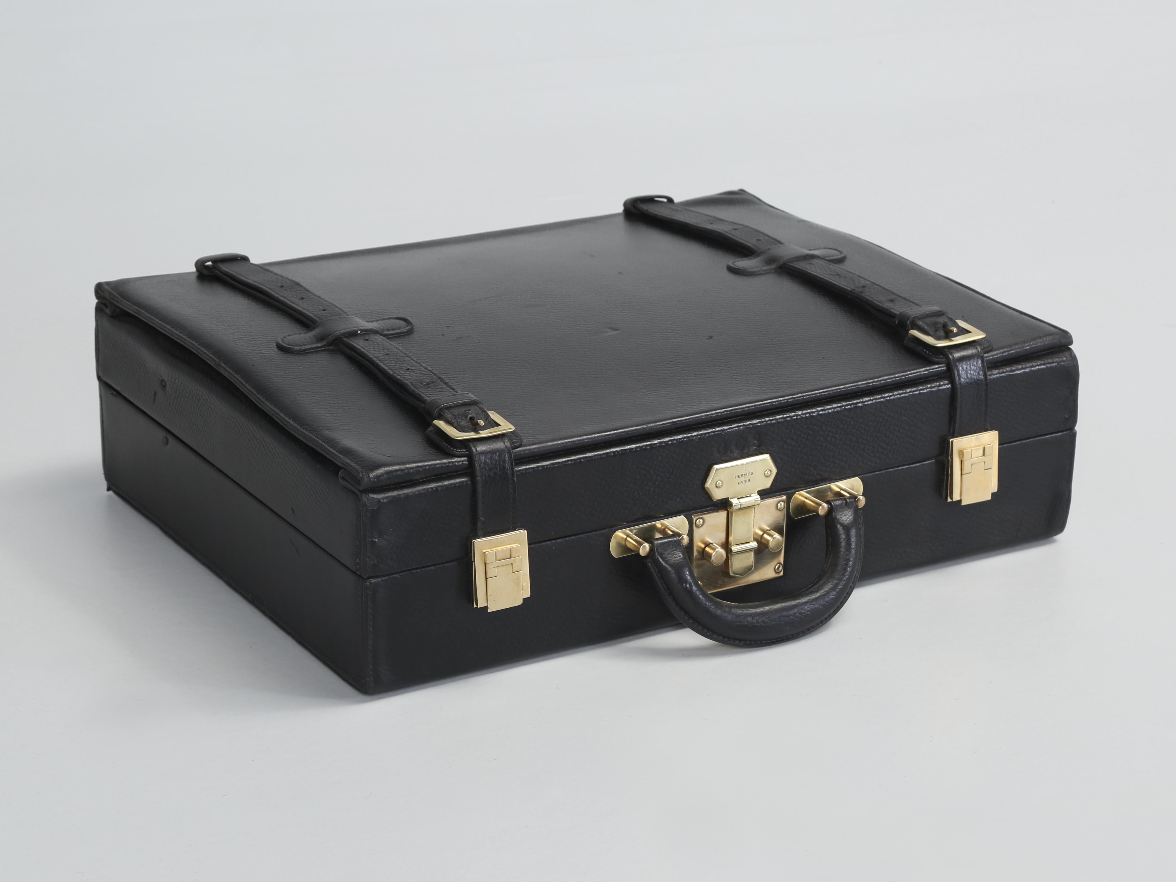Hermès Vintage Leather Briefcase that expands with the assistance of a Pair of Leather Straps. We tried very hard to research this incredible Hermès Black Leather Briefcase with the Leather Straps, however, we could not find another one after