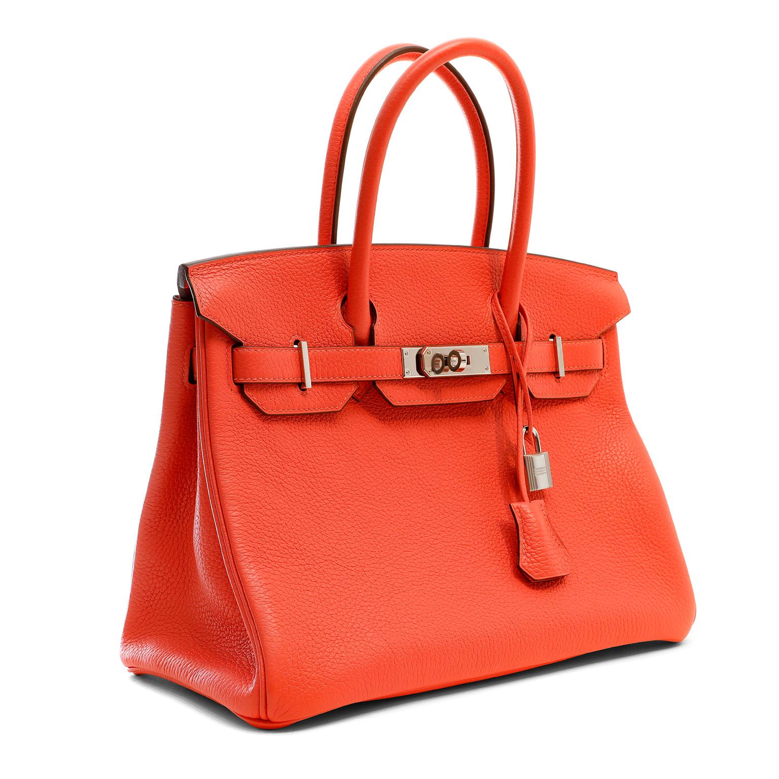 This authentic Hermès Raspberry Clemence 30 cm Birkin is in pristine condition with the protective plastic on the hardware.  Hermès bags are considered the ultimate luxury item the world over.  Hand stitched by skilled craftsmen, wait lists of a