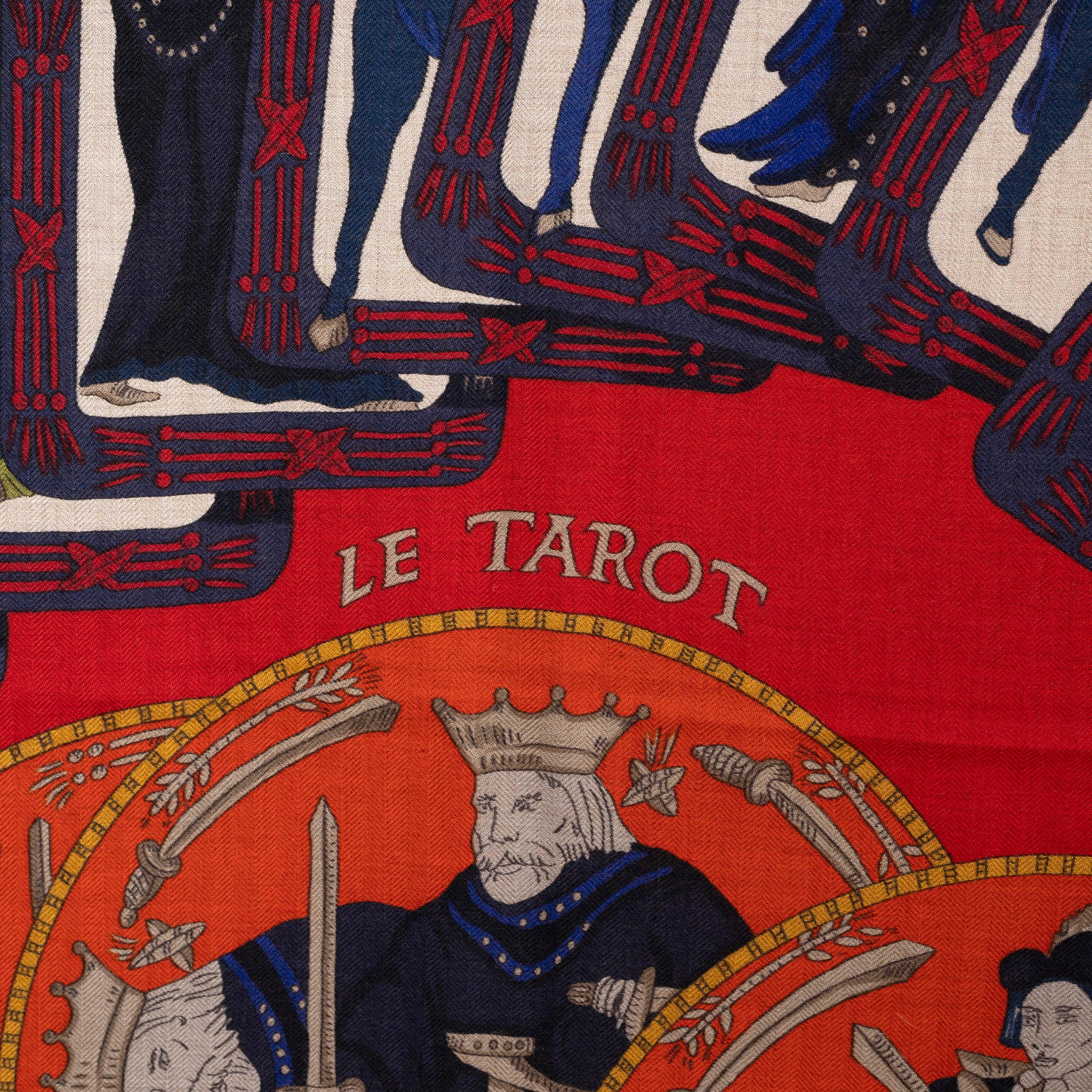 This 100% authentic Hermès Le Tarot 140 cashmere (65%) and silk (35%) shawl in raspberry with details in navy, mustard, red and taupe features beautifully woven Tarot card-inspired motifs. The Hermès shawl would use these symbols in a refined and