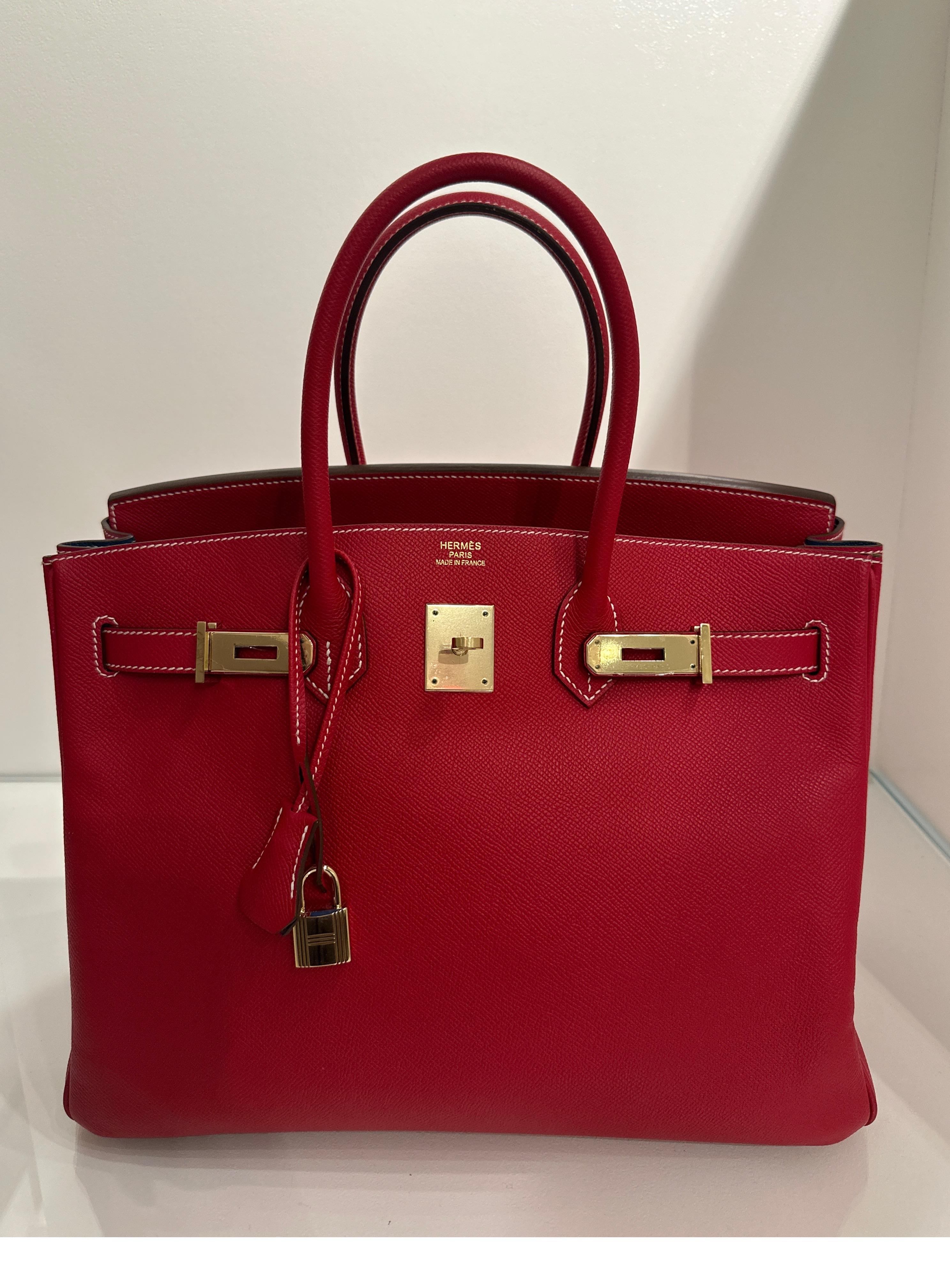 Hermes Rouge Casaque Birkin 35 Bag. Beautiful red Birkin with blue mykonos interior. Candy collection. Gold hardware. Epsom leather. Excellent condition. Plastic is still on hardware. Includes dust bag and box. Guaranteed authentic. 