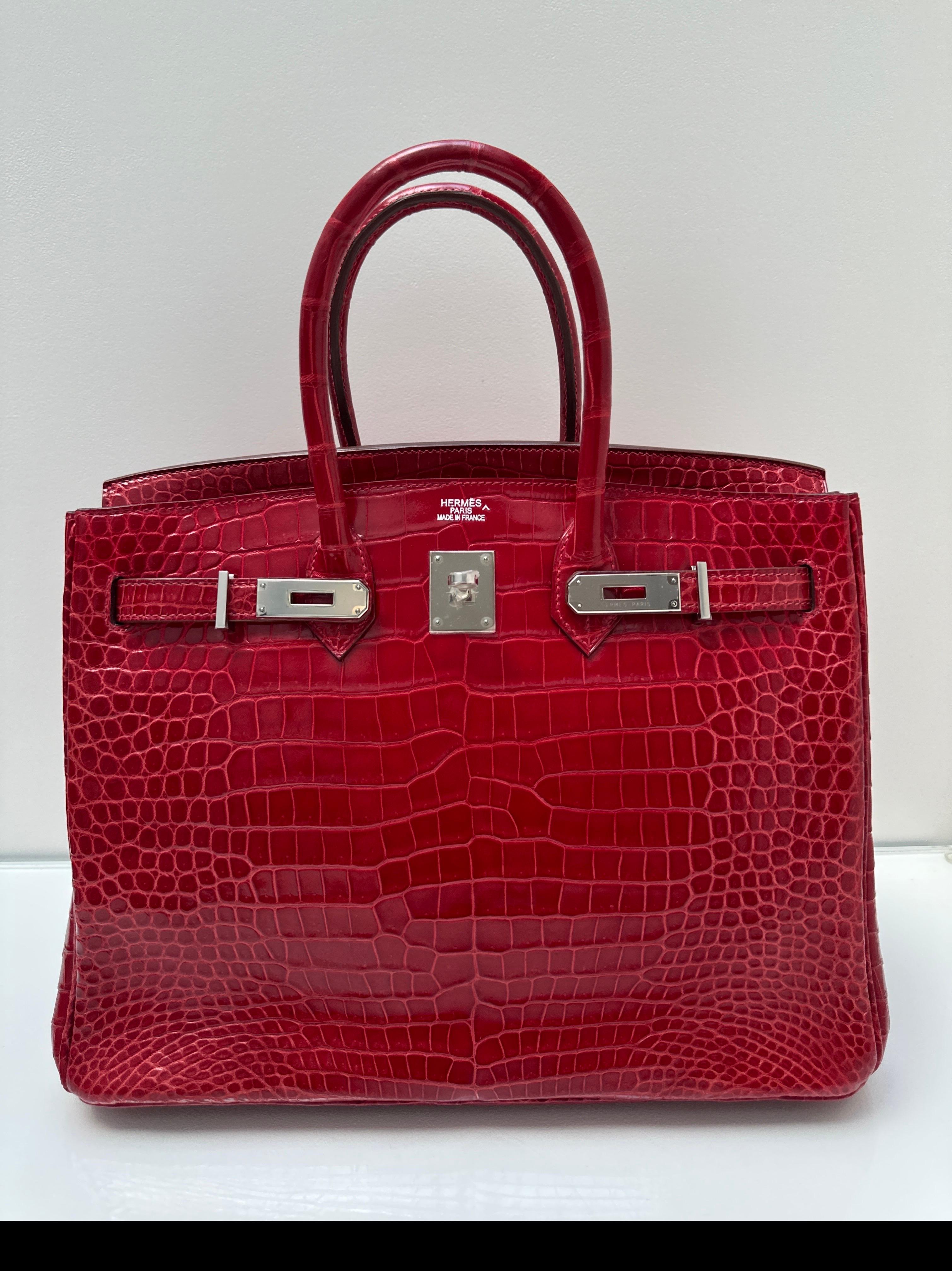 Hermes Red Crocodile Birkin 35 Bag. Exotic rare leather. Palladium silver hardware. Gorgeous red color. Interior clean. Looks like new. Excellent condition. Best investment bag. Priced to sell. Includes clochette, lock, keys, and dust bag.