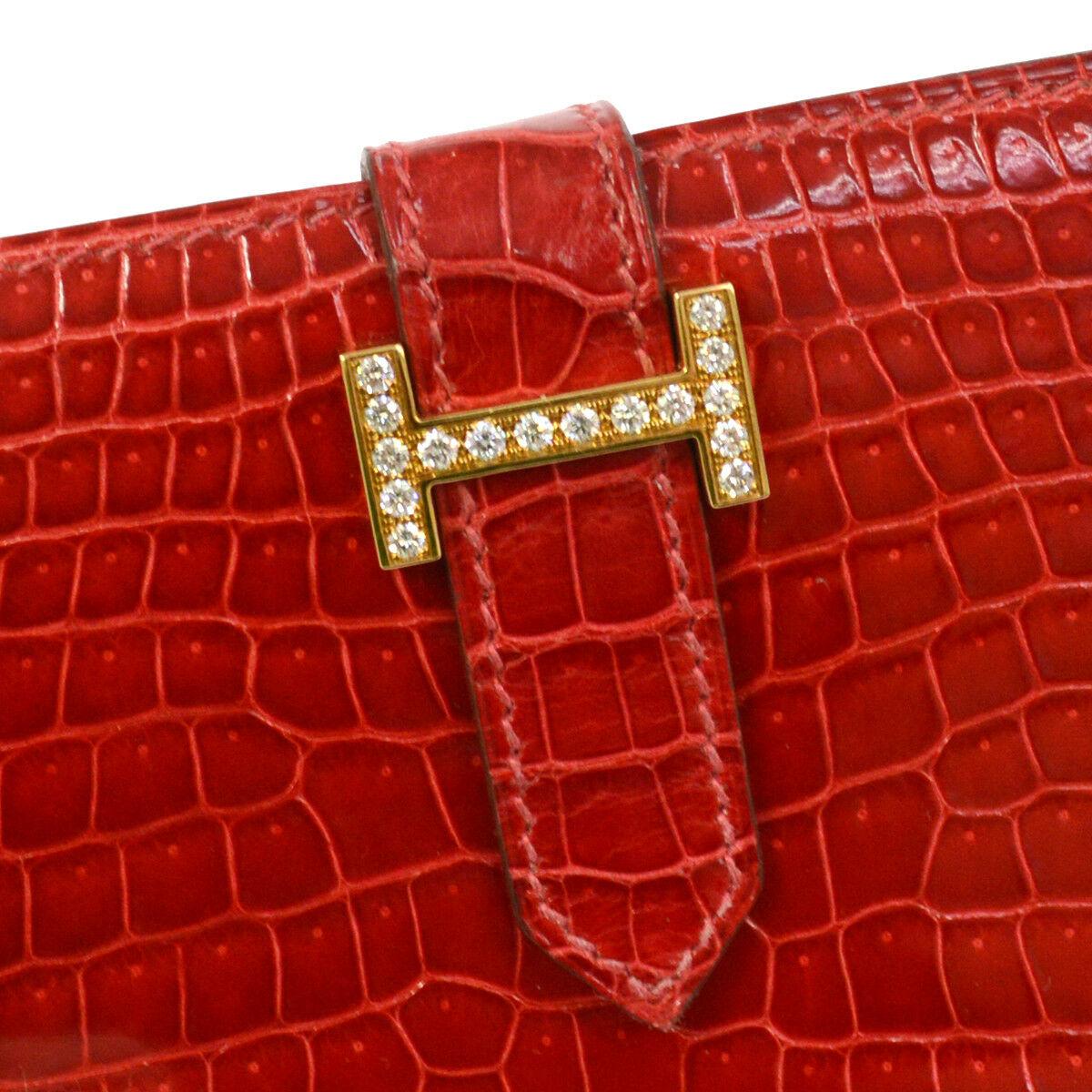 Hermes Red Crocodile Exotic Leather Diamond 'H' Gold Envelope Clutch Wallet

Crocodile
Diamond
Gold tone hardware
Buckle closure
Date code present
Made in France
Measures 7