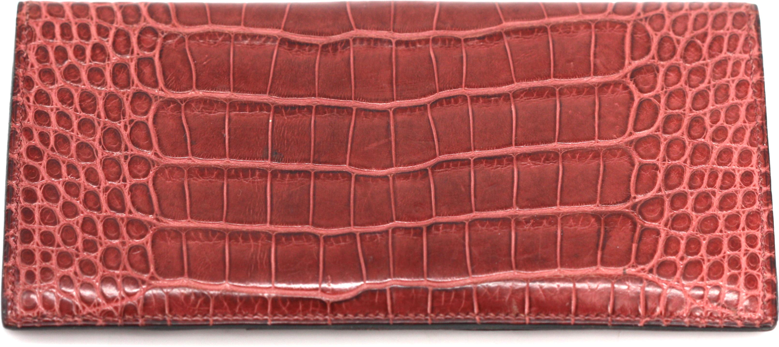 
Hermes Red Crocodile Leather Billfold
Marked on the inside. Rectangular, opening to multiple card and bill pockets, with box and ribbon, appears unused.
3.75 by 7 in.
Condition Report
Good condition.