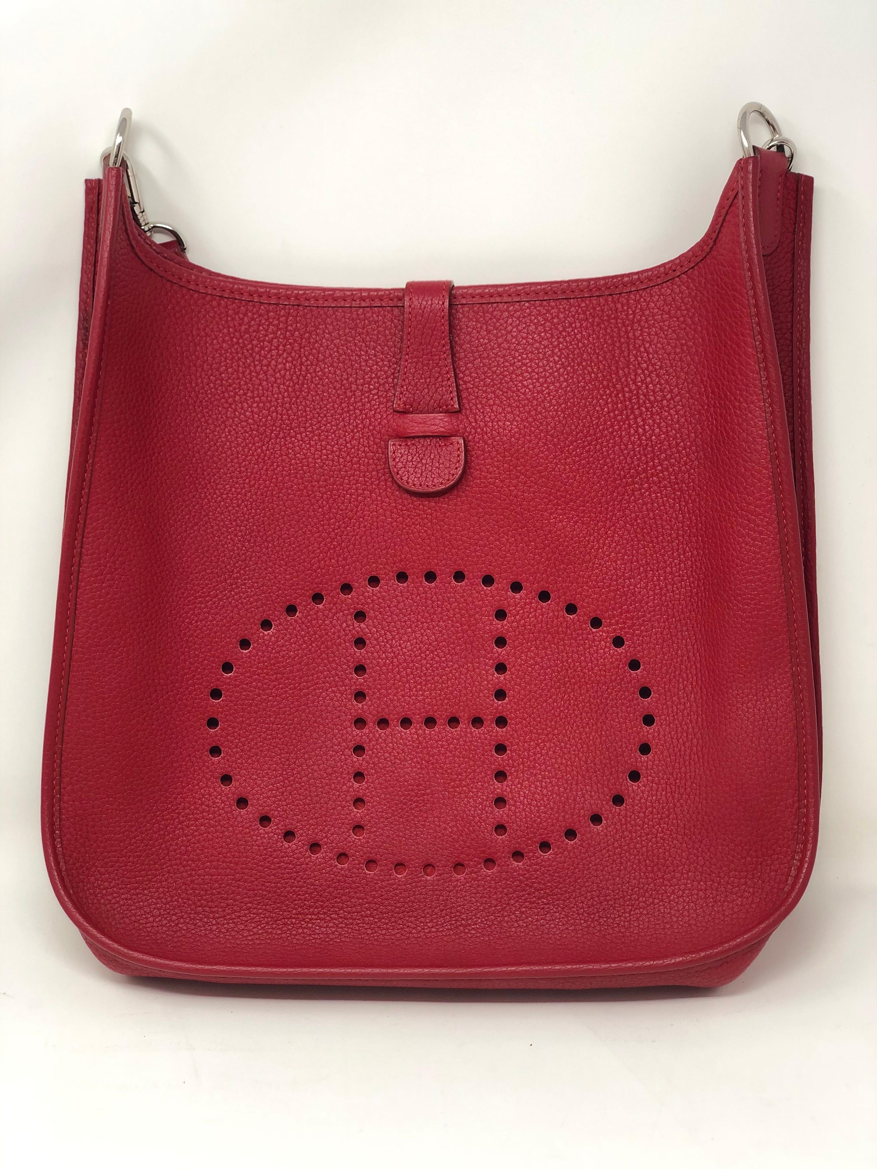 Hermes Red Evelyne Bag. Series One. Vintage Hermes Bag with red strap. GM size. Good condition. Rare and hard to find color. One small darker leather spot on back of bag. Please see photos. Guaranteed authentic. 