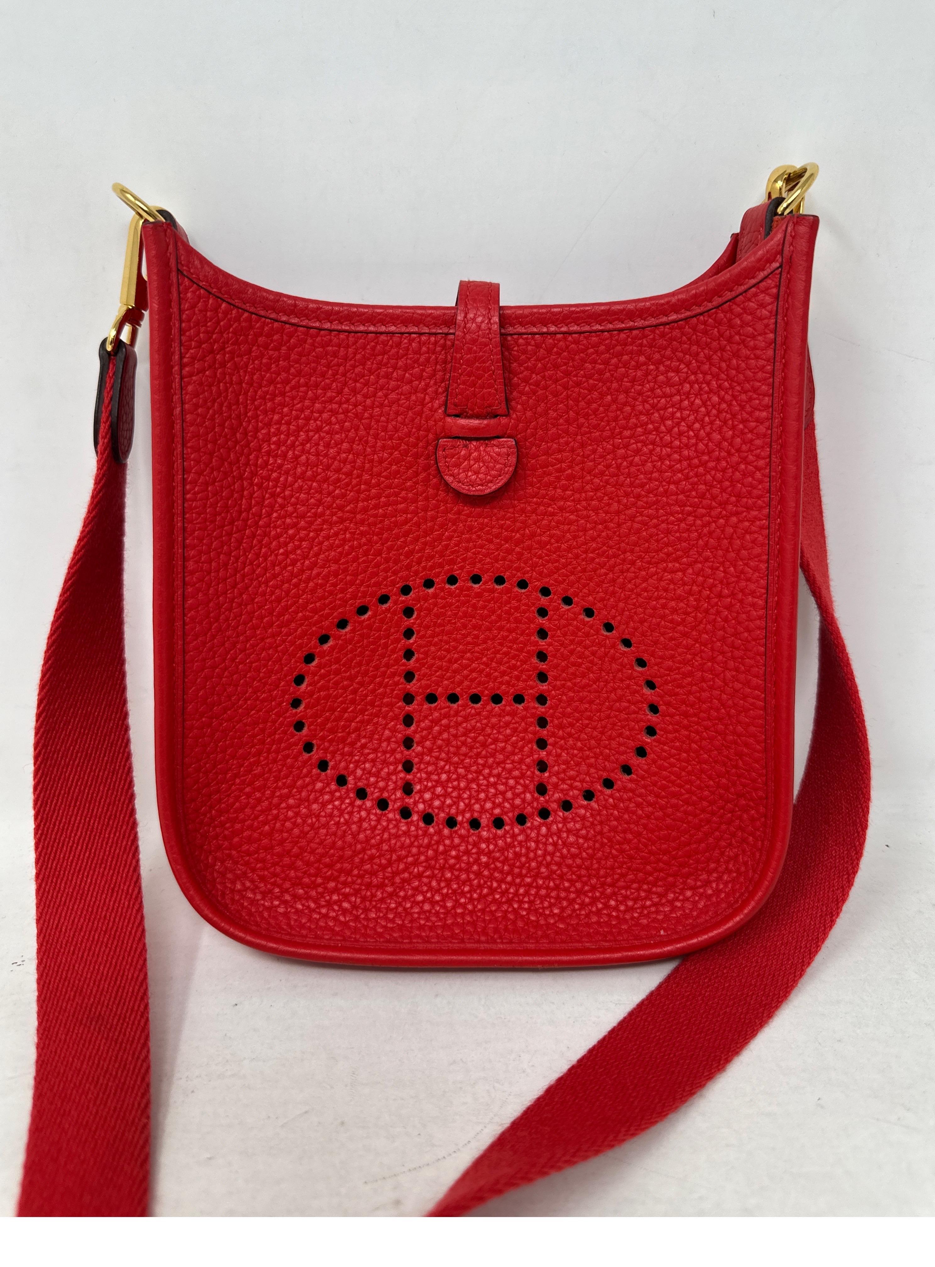 Hermes Red Evelyne TPM Bag. Mini size Evelyne. Rare red color. Gold hardware. Excellent condition. Interior clean. Hard to get mini size. Includes dust bag. Guaranteed authentic. 