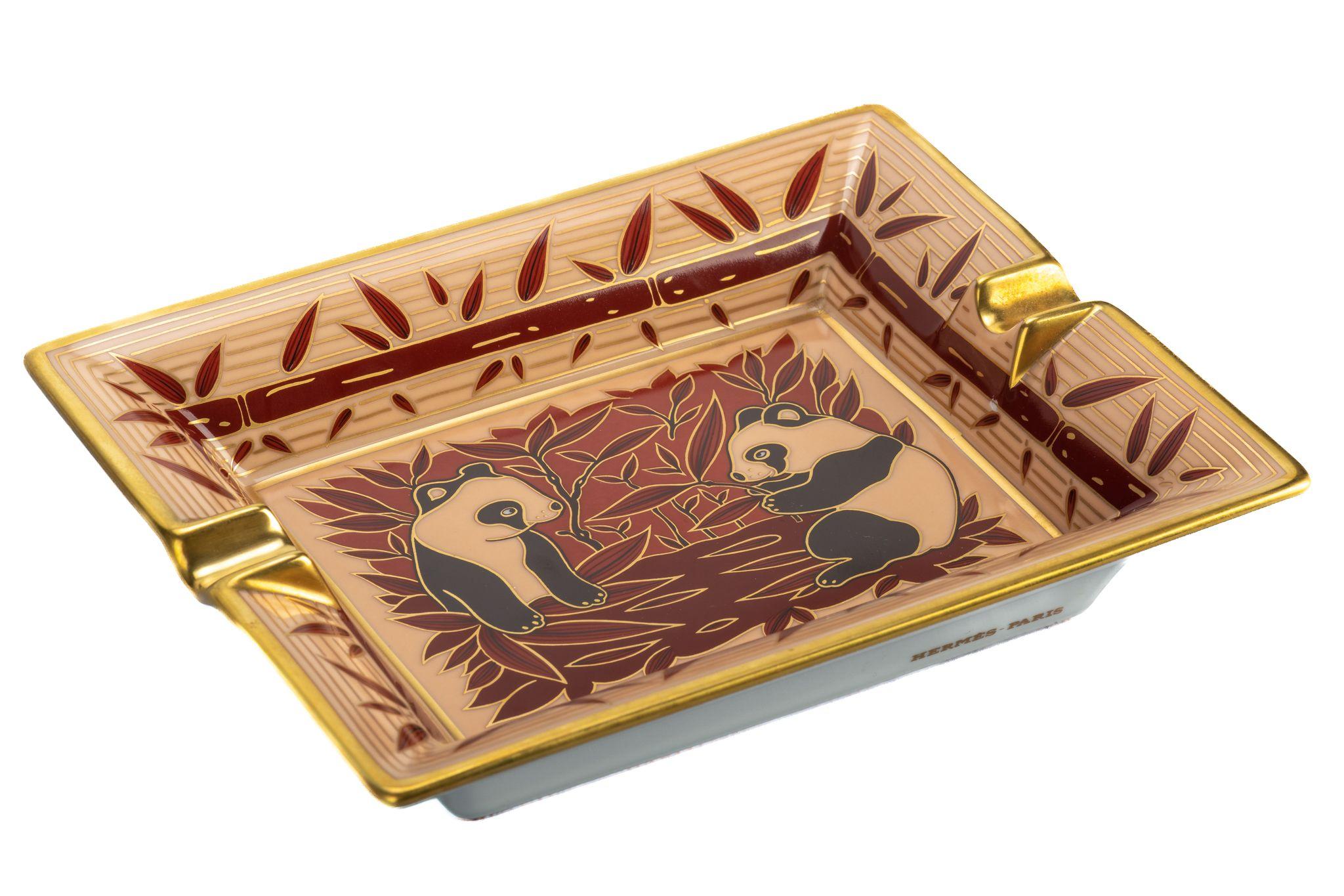 Hermes dark red and cream porcelain ashtray with pandas design.