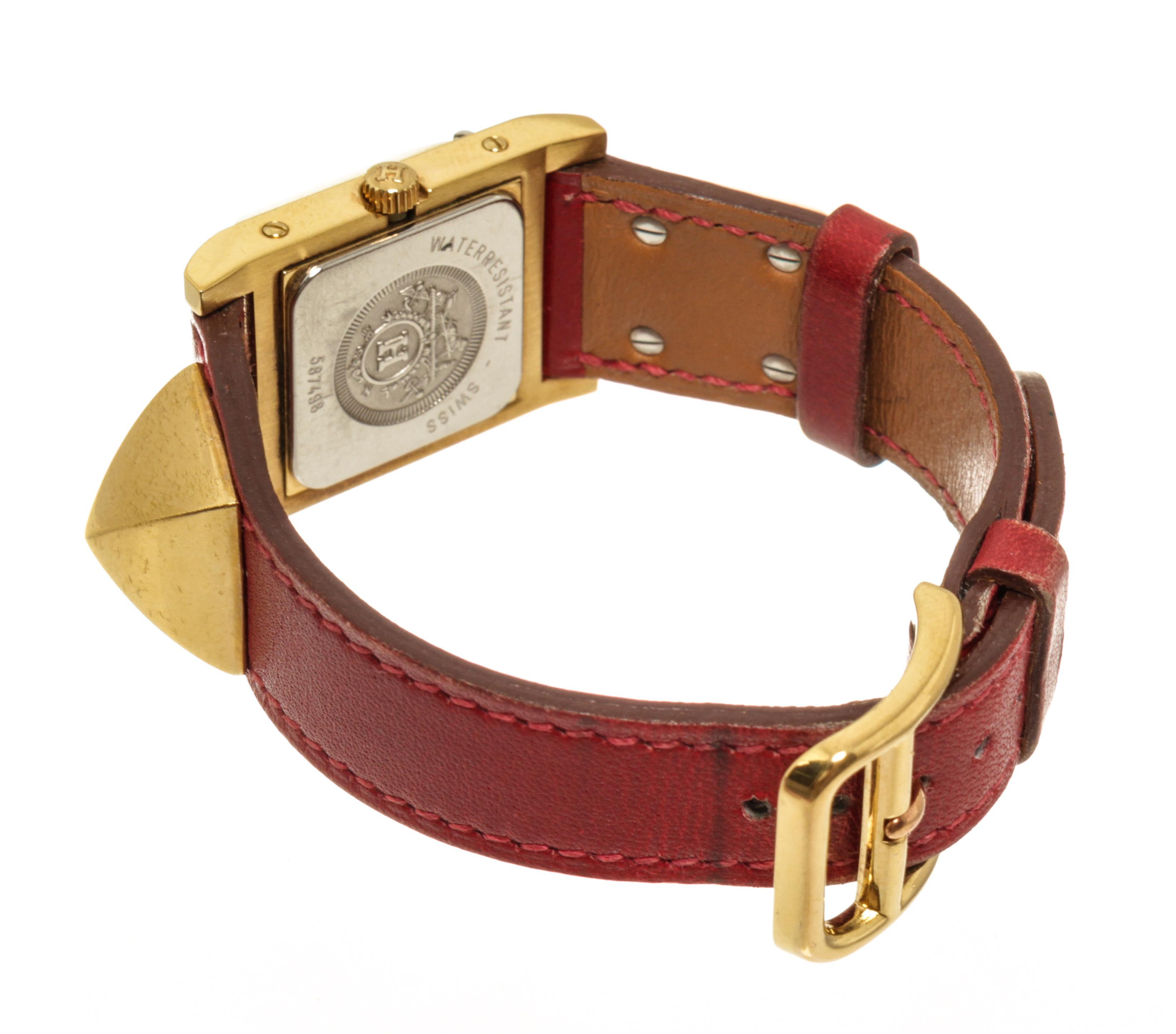 Rote vergoldete und vergoldete Medor-Quarz-Uhr von Hermès Damen