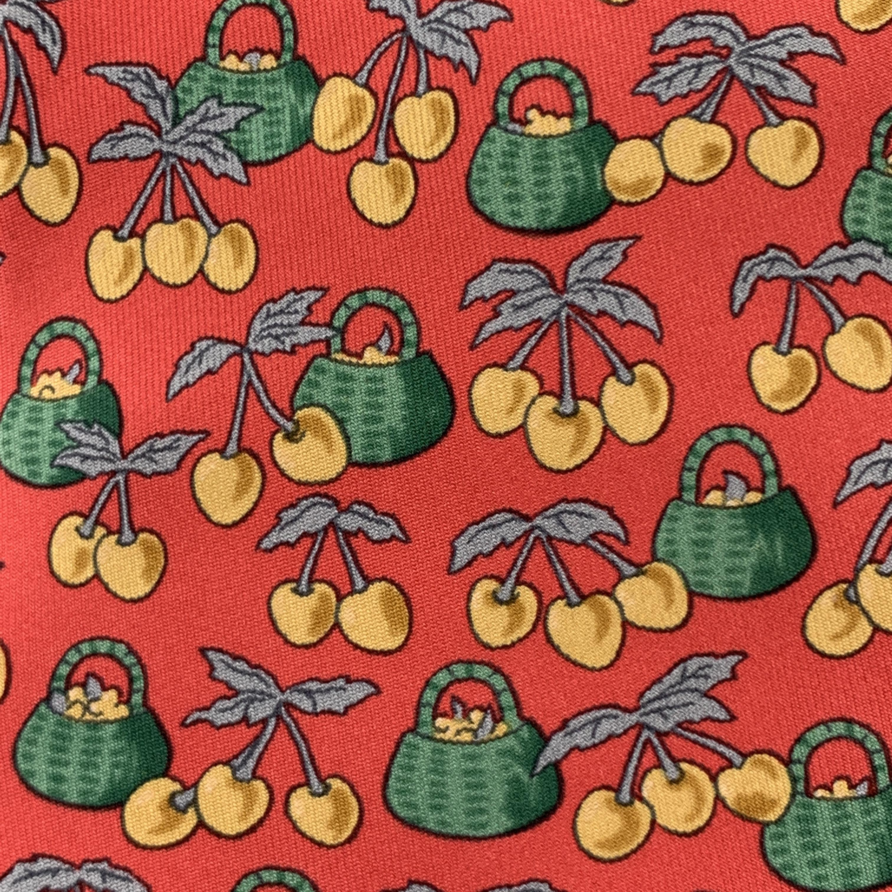 HERMES necktie comes in red silk twill with all over green basket and yellow cherries print. Made in France.

Excellent Pre-Owned Condition.

Width:  3.75 in.