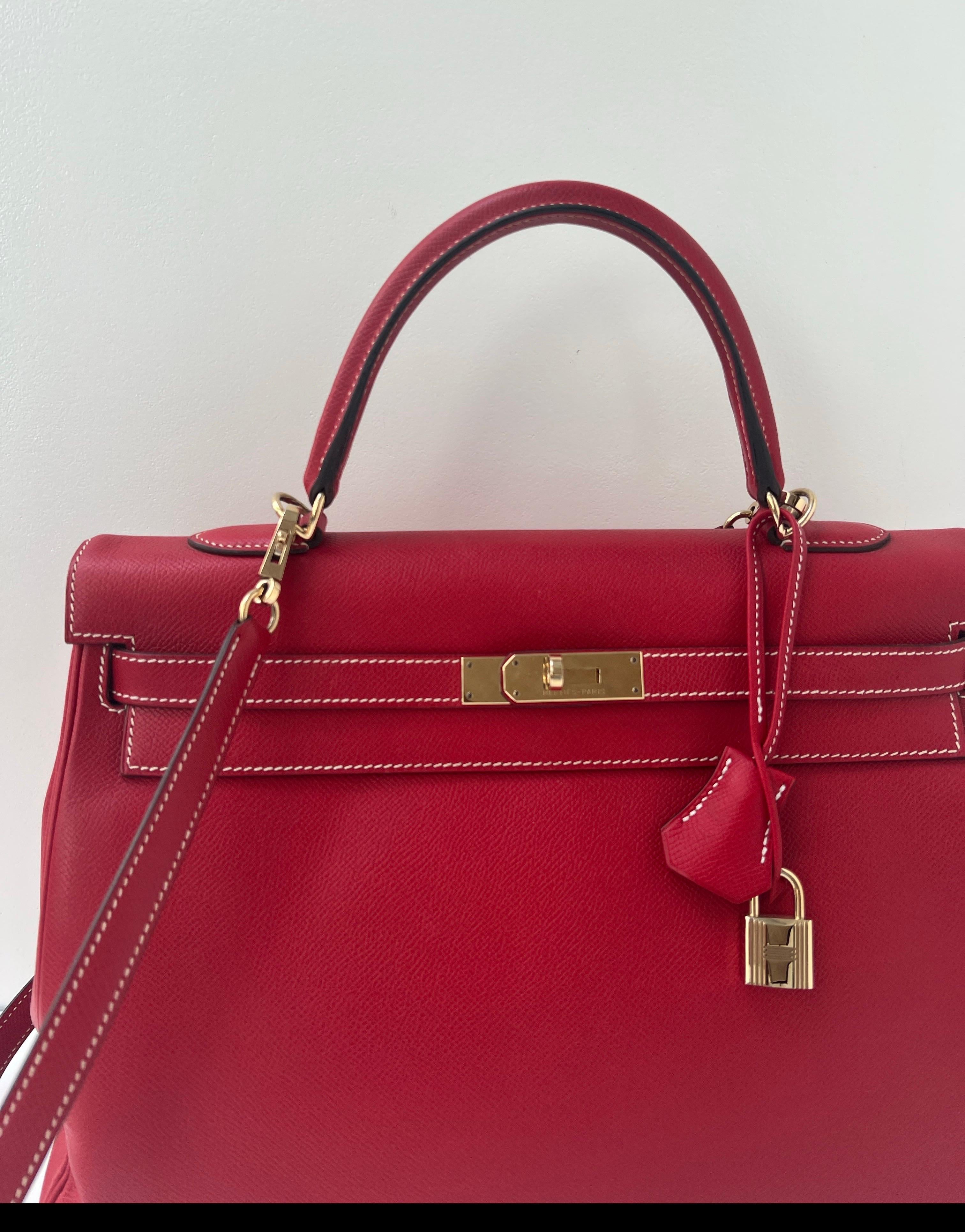 Hermes Rouge Casaque Kelly 35 Bag. Stunning red with blue interior. Candy collection. Gold hardware. Interior clean. Includes clochette, lock, keys, and dust bag. Guaranteed authentic. 