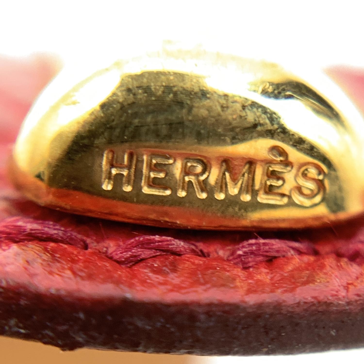 Beautiful Hermes 'Agatha' bracelet. Red leather with a bamboo motif gold metal . The leather bracelet is removable and the metal structure can be worn as a bracelet in its own right. 'Hermes Paris - Made in France' embossed internally. 'Hermes'
