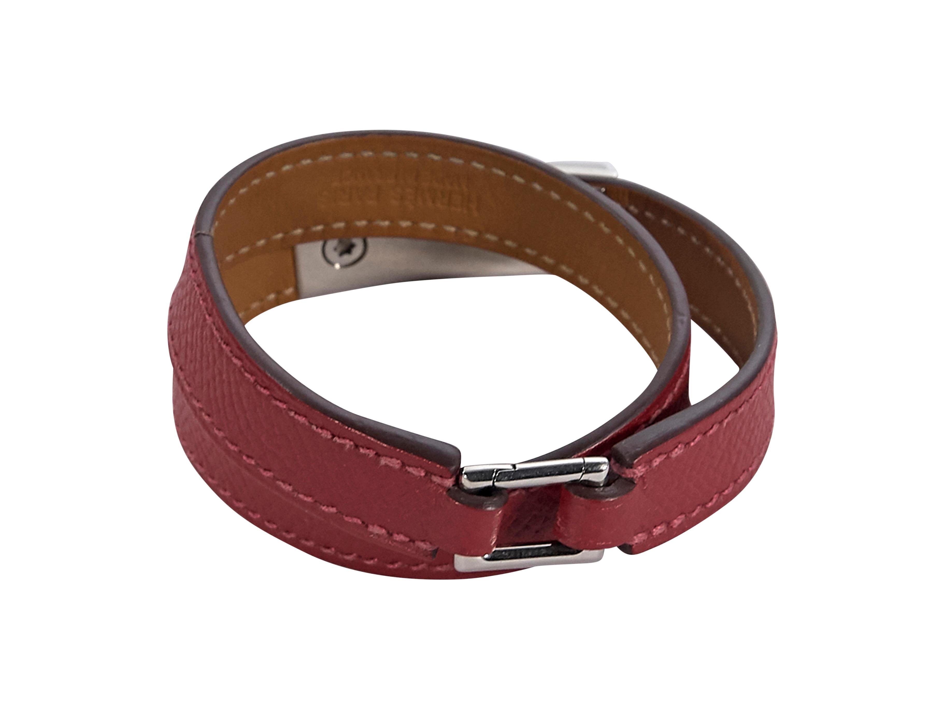 Product details:  Red leather Epsome Rivale wrap bracelet by Hermes.  Square clasp closure.  Silvertone hardware.  13.5