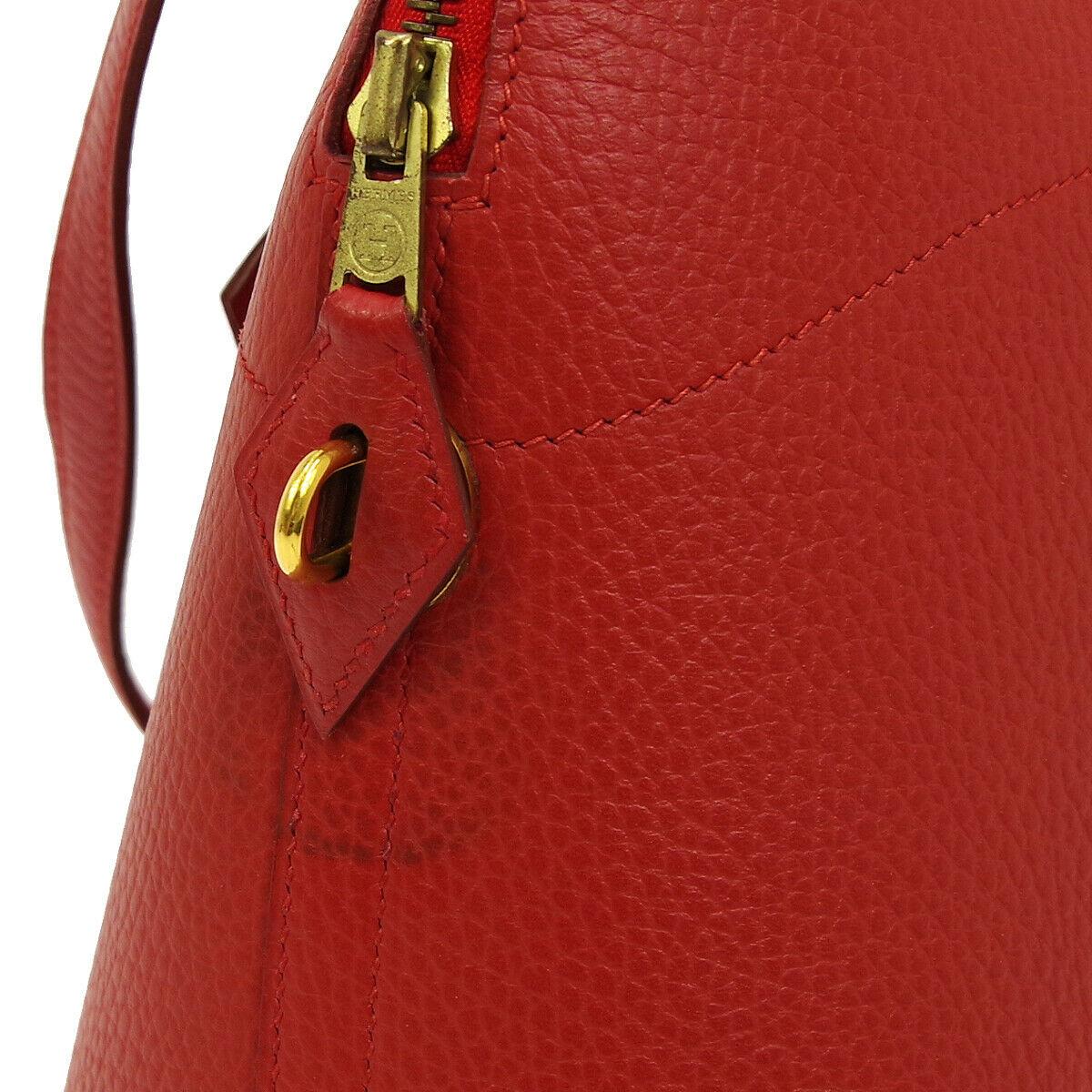 Hermes Red Leather Bolide Gold Top Handle Satchel Carryall Travel Shoulder Tote Bag

Leather
Gold tone hardware
Zipper closure
Date code present
Made in France
Handle drop 4