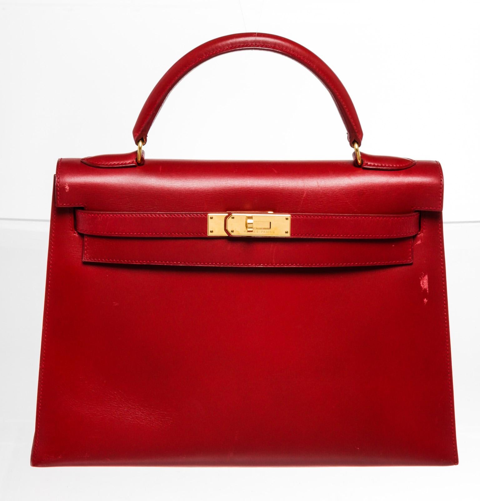 Hermes Red Leather Kelly 32cm Handbag with leather, gold-toneÂ hardware, trim leather, interior zip pocket, lining leather, top handle,Â and turn lockÂ closure.Â PLEASE NOTE: Item redyed.

48995MSC