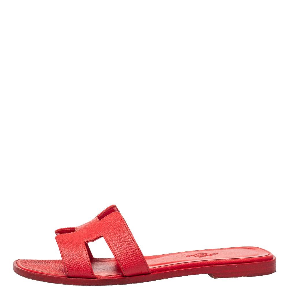 Put your best foot forward this season in these pretty Hermes sandals. These red Oran sandals have been crafted from leather in Italy and they feature the iconic H on the vamps as well as insoles meant to provide comfort at every step. These sandals