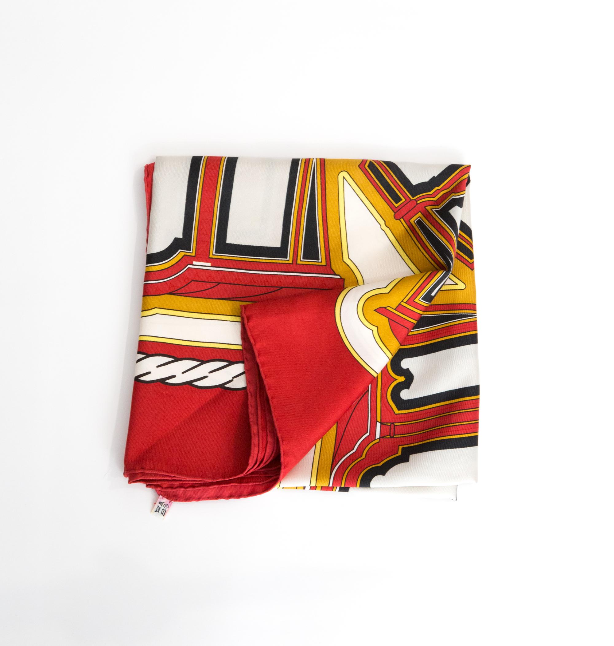 Hermes red « Les Berlines » by F. de la Perrière silk scarf featuring a red border and a Hermès signature. 
Circa 1980s
In good vintage condition. Made in France.
35,4in. (90cm)  X 35,4in. (90cm)
We guarantee you will receive this  iconic item as