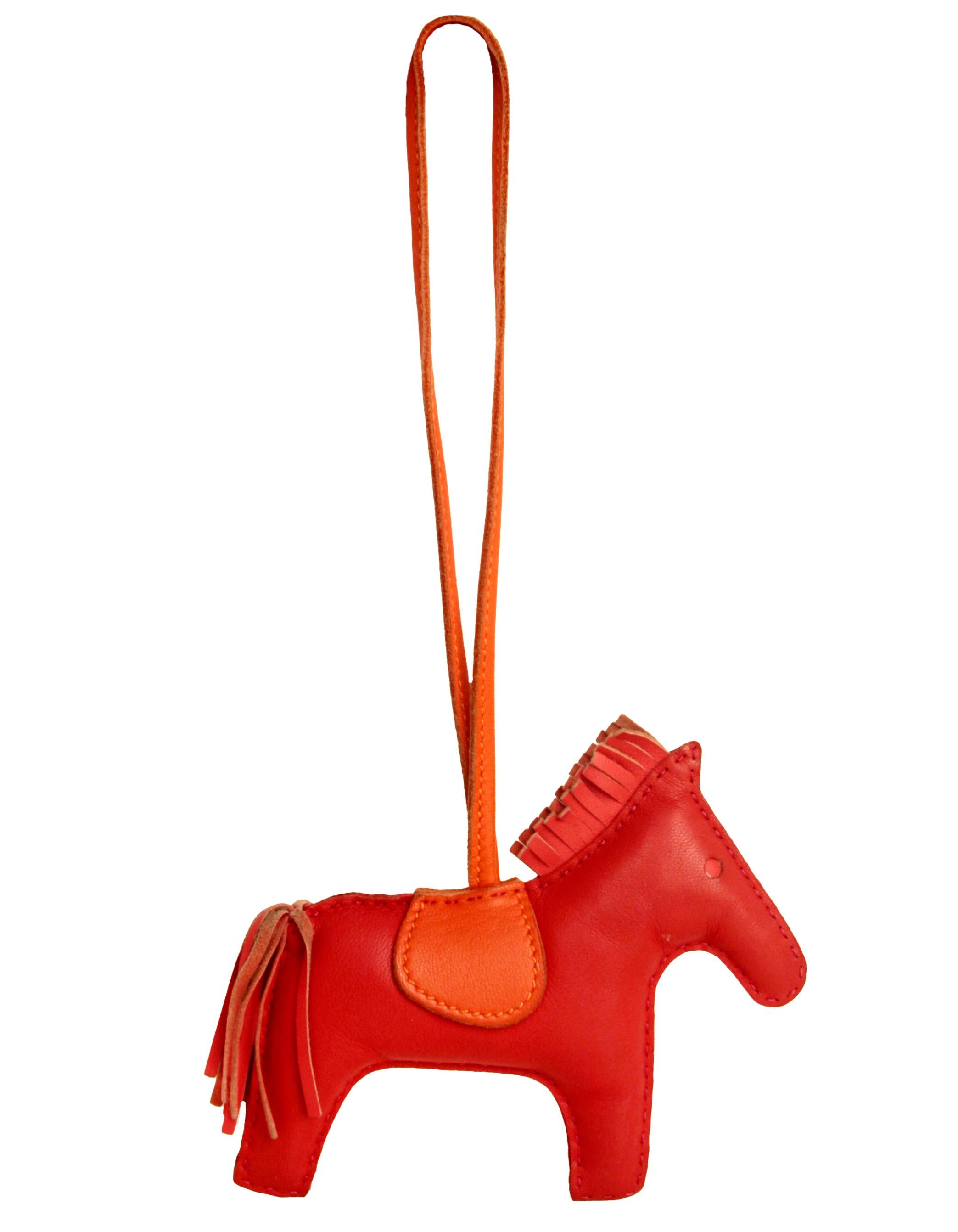 Hermes Red/Orange Rodeo MM Bag Charm
Made In: France
Color: Red and orange
Materials: Swift leather
Closure: Loop
Stamp: HERMES PARIS MADE IN FRANCE
Overall Condition: Excellent pre-owned condition
Measurements:
4.75