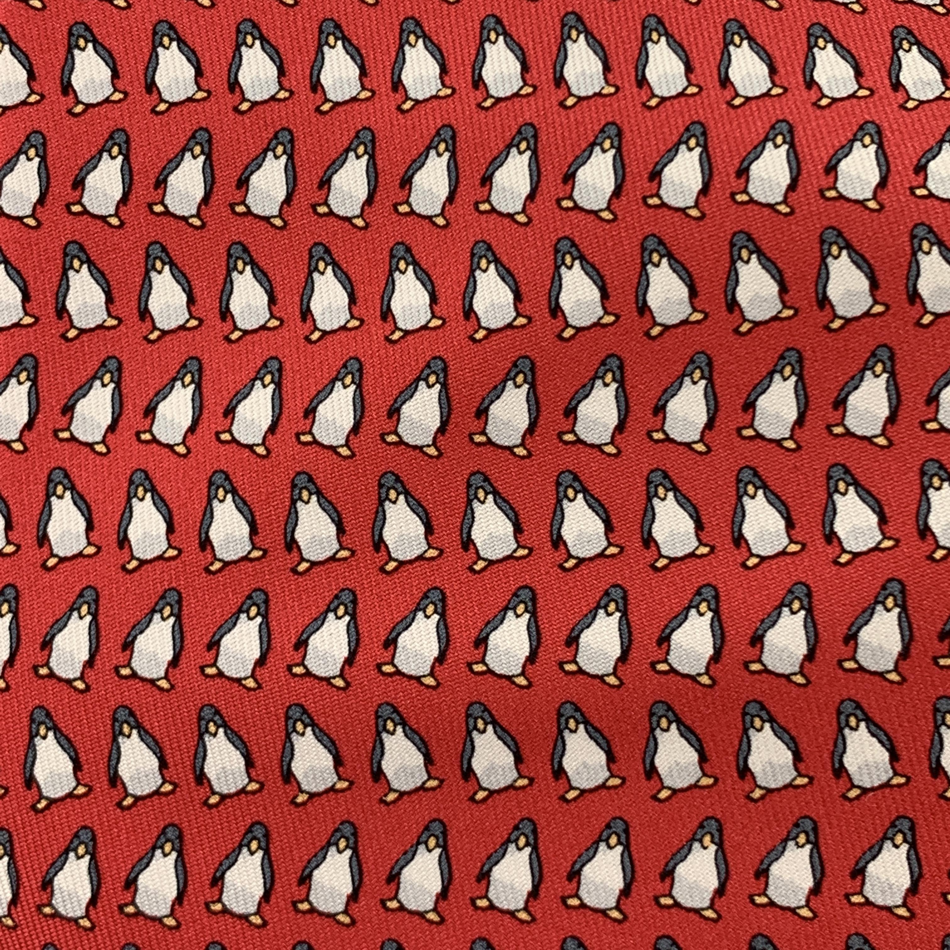 HERMES necktie comes in red silk twill with all over penguins print. Made in France.

Excellent Pre-Owned Condition.

Width: 3.75 in.