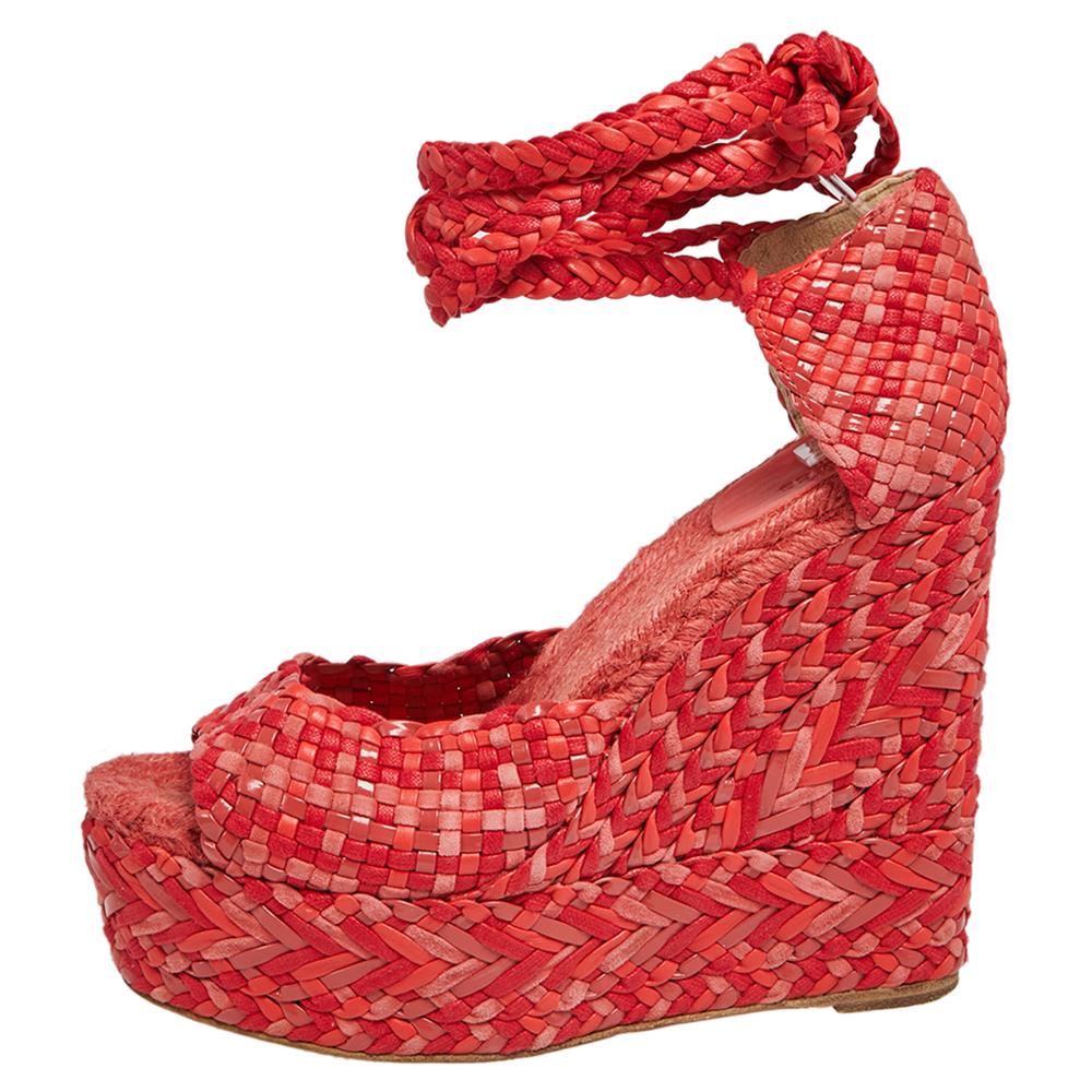 Get these Epice Tresse sandals home today, crafted by the house of Hermes. Having a woven exterior made from leather & suede, the red & pink sandals are contemporary and chic. They have wedge heels, ankle wraps, and espadrille insoles.

Includes: