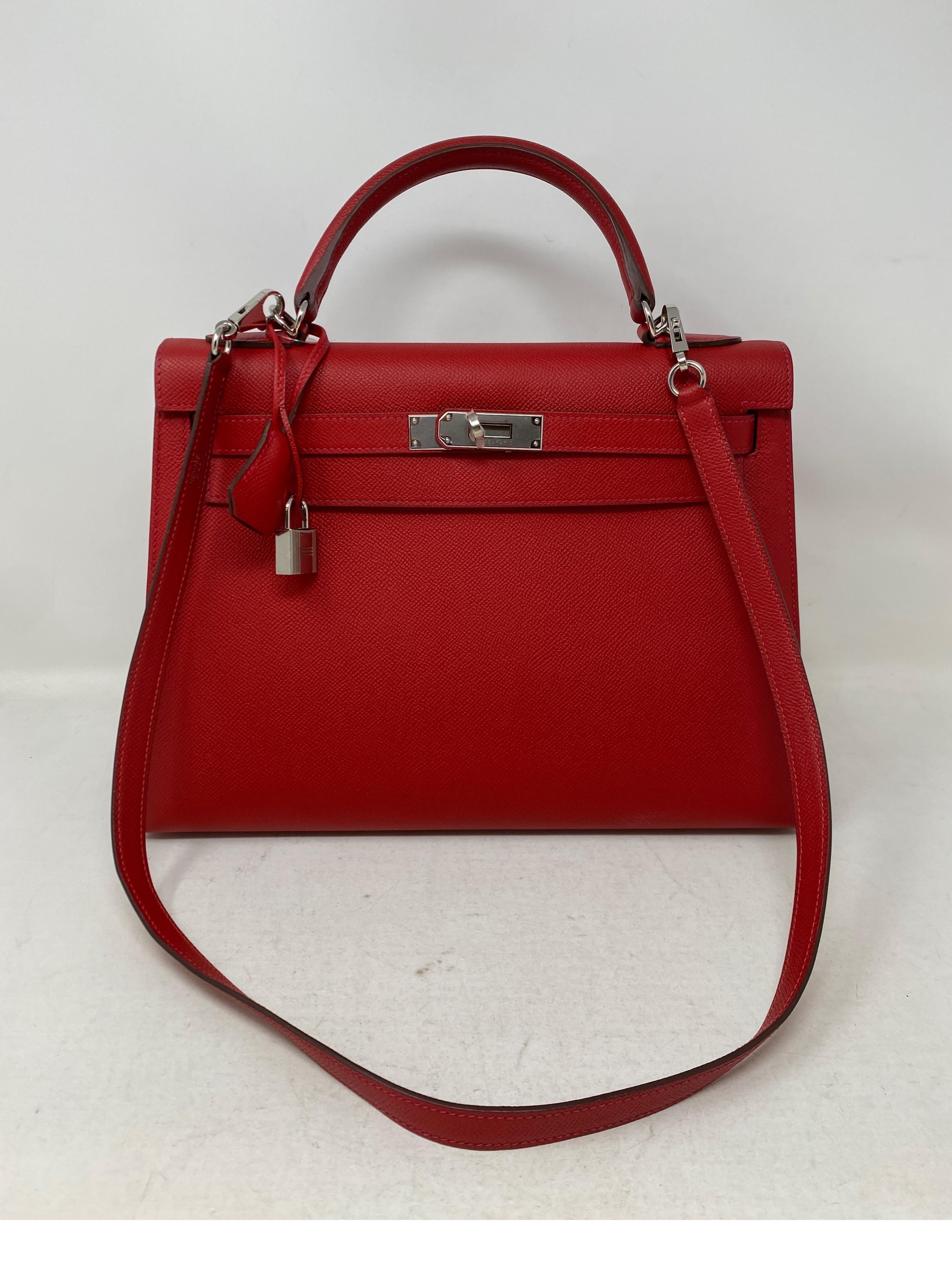 Hermes Red Rouge Casaque Kelly 32 Bag. Palladium silver hardware. New condition. Plastic still on hardware. Epsom leather and sellier. Highly coveted sellier and size 32. Beautiful red leather. Includes clochette, lock, keys, and dust bag.