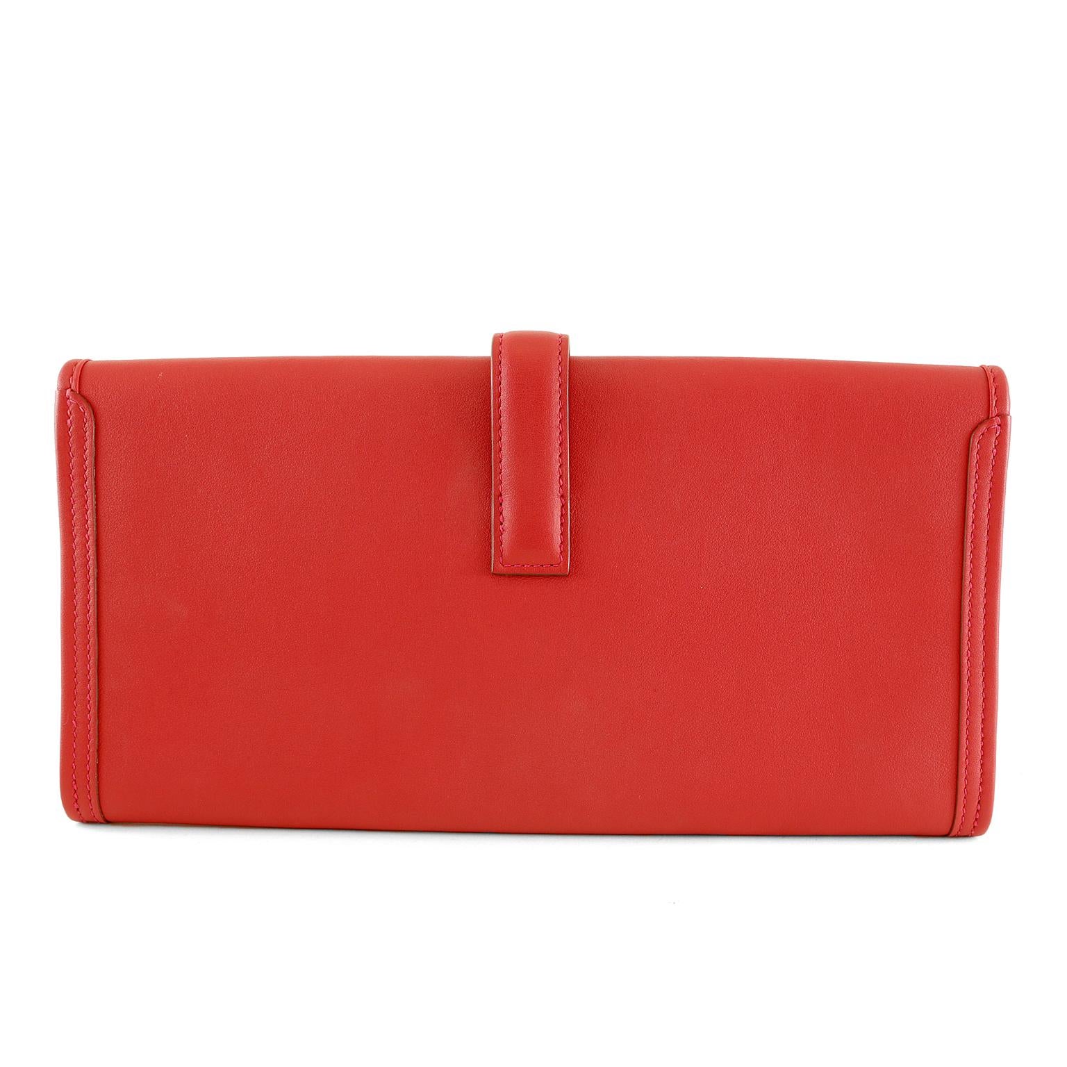 Hermès Red Swift Jige Elan 29- NEW; Never Carried
The penultimate clutch for any occasion, it is a must have for any sophisticated wardrobe.  
Lipstick red smooth Swift calfskin slim clutch has an H belted closure.  Red leather interior.  C stamp.  