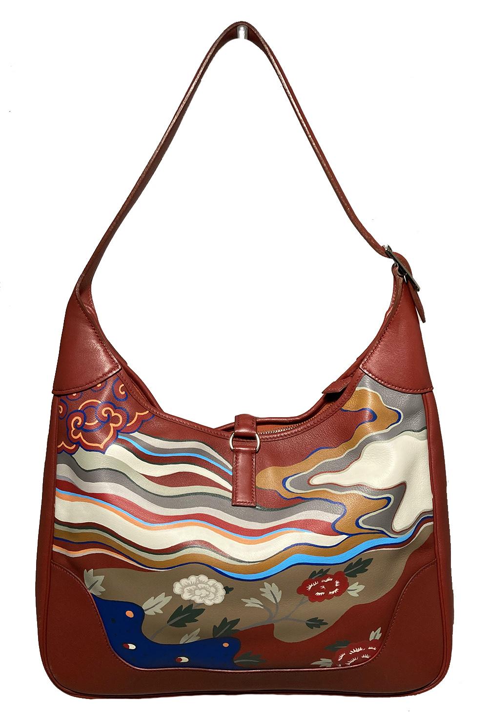 Hermes Red Trim Bag Hand Painted in excellent condition. Brick red swift leather exterior featuring an original hand painted artistic landscape with blue, green, tan, beige, orange and white throughout. Silver palladium hardware. Top zipper opens to