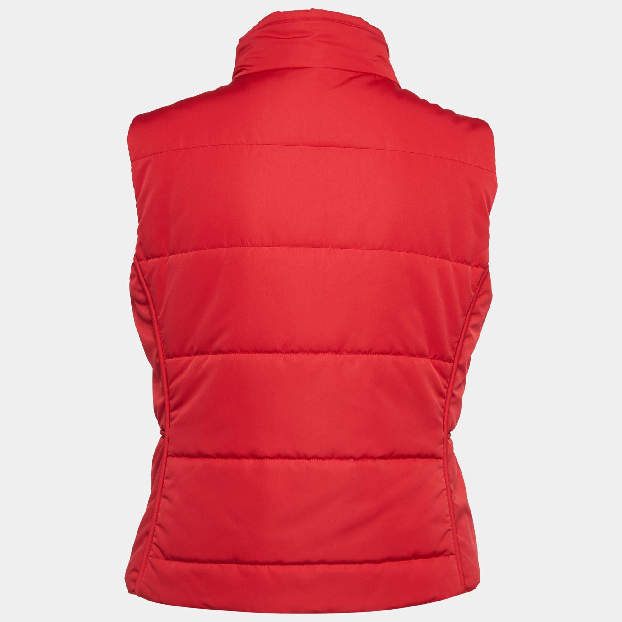 Wrap yourself in the refined luxury of the Hermès vest. Crafted with precision and finesse, this vest boasts a sleek silhouette and quilted design. Its vibrant red hue adds a pop of color to any ensemble, while the sleeveless cut offers versatility