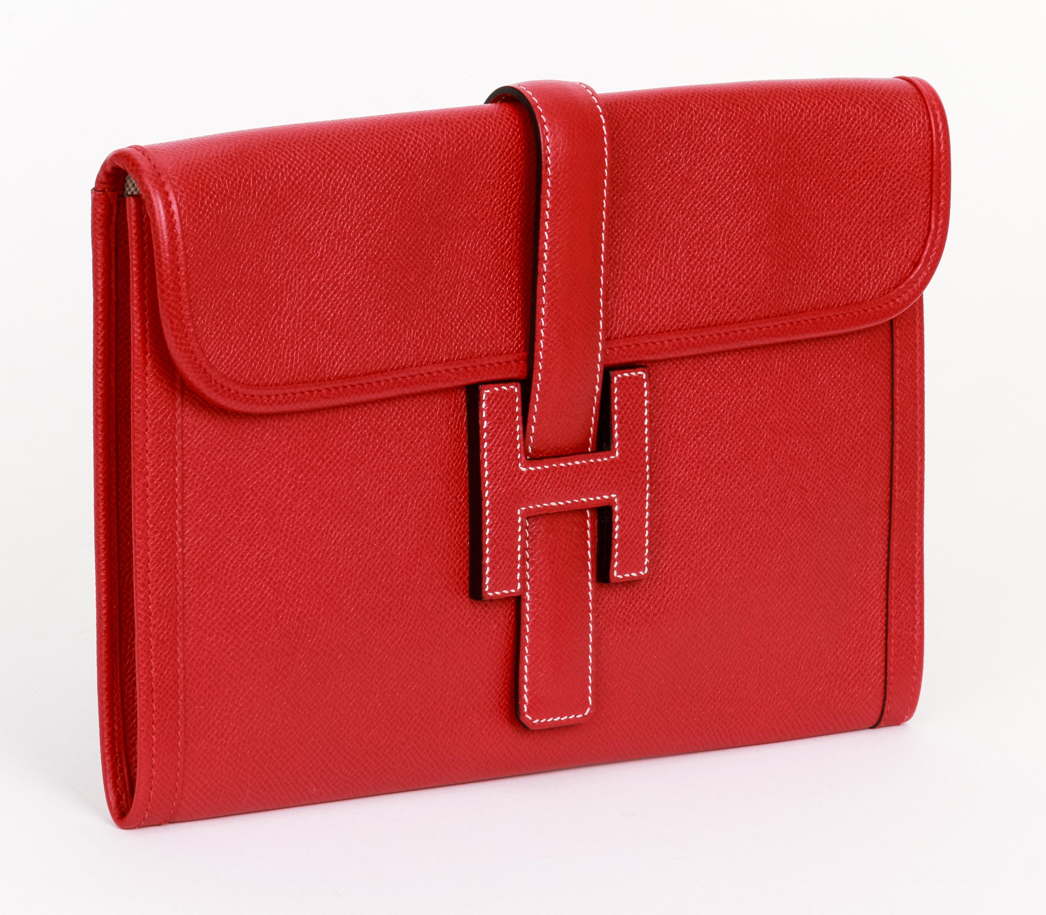 Hermès red epsom leather jige clutch. White contrast stitching, toile interior. Comes with original dust bag.