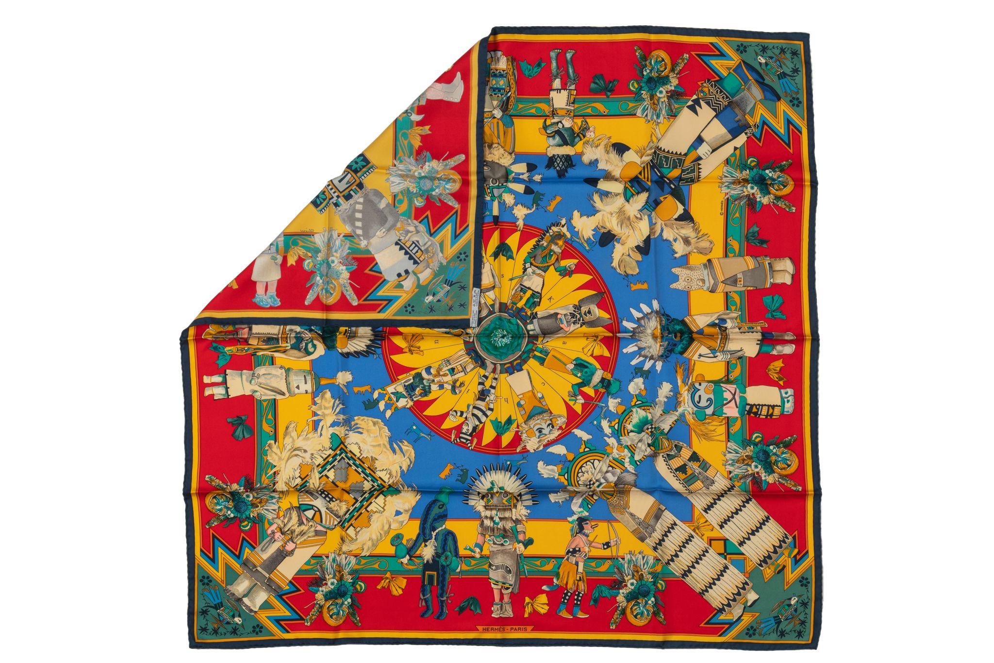 Hermès collectible red yellow silk twill Kachinas scarf designed by Kermit Oliver. Hand-rolled edges. No box.