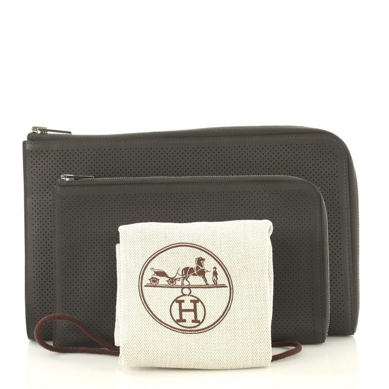 This Hermes Remix Duo Wallet Perforated Swift Medium, crafted from Graphite gray Swift leather, features palladium hardware. Its zip closure opens to a Graphite gray Swift leather interior with multiple card slots. Date stamp reads: R Square (2014).