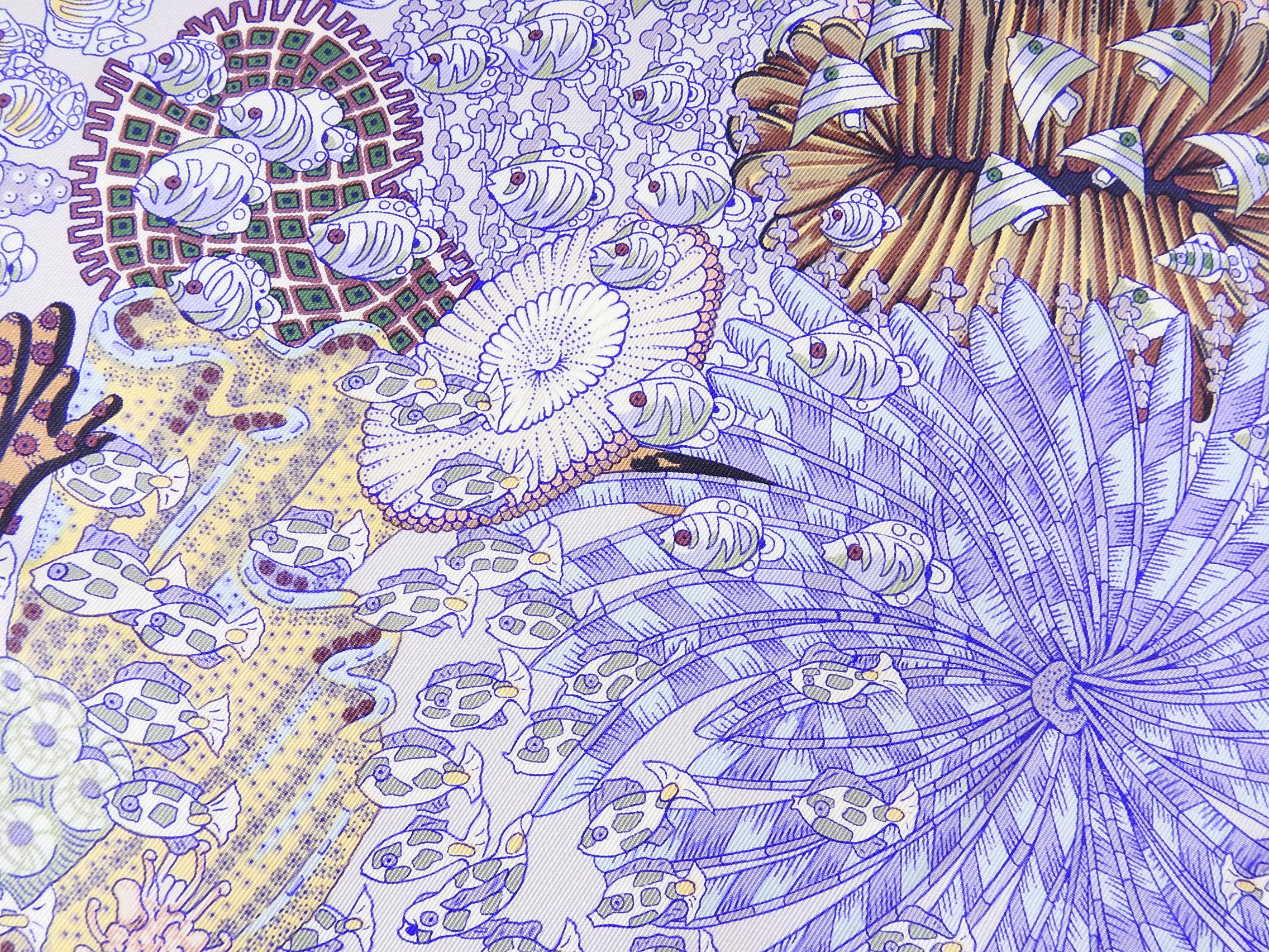Hermes Rencontre Ocean Light Purple Fishes Silk 90cm Scarf.  Design of tropical school of fish and coral in lavender purple, green, yellow, and plum colors.  Excellent pre-owned condition.