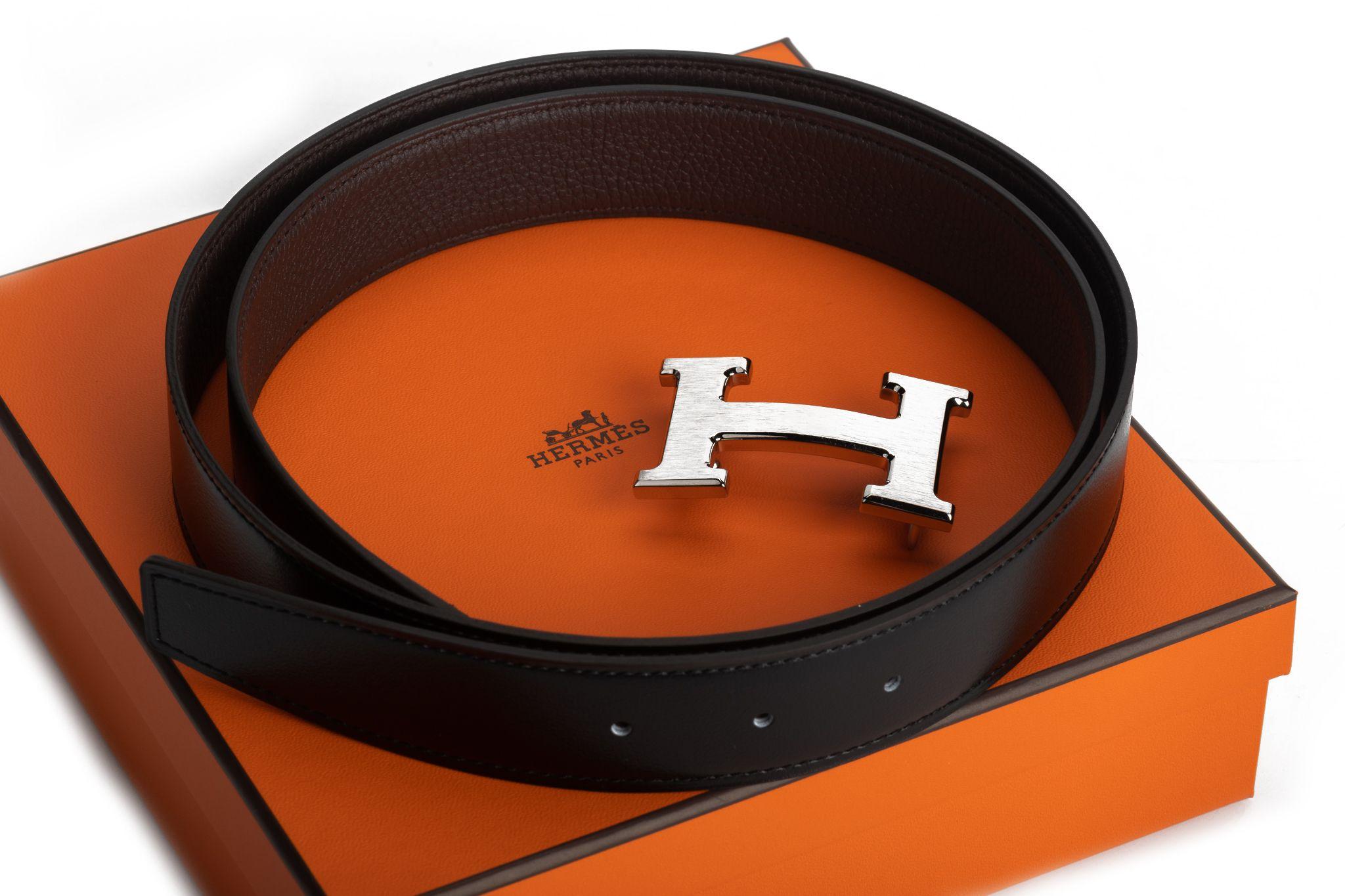 Hermèsbrand new black and brown reversible H belt. Palladium buckle, 95 cm long. Date stamp Y. It comes with original dustcover and box.
