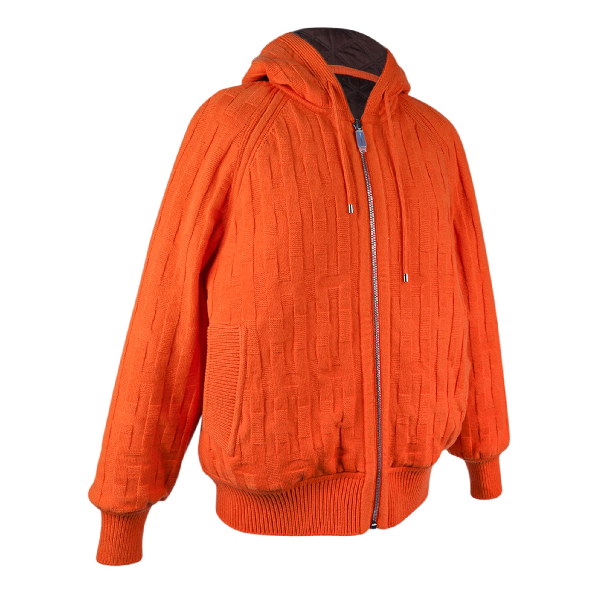 Mightychic offers an Hermès Reversible Zip Cardigan featured in Orange Saturne and Brown.
Warm with hood and quilted cotton, wool and plume canvas.
Virgin wool with Losanges and H motifs.
Reverses to wadded brown quilted side with Orange ribbed