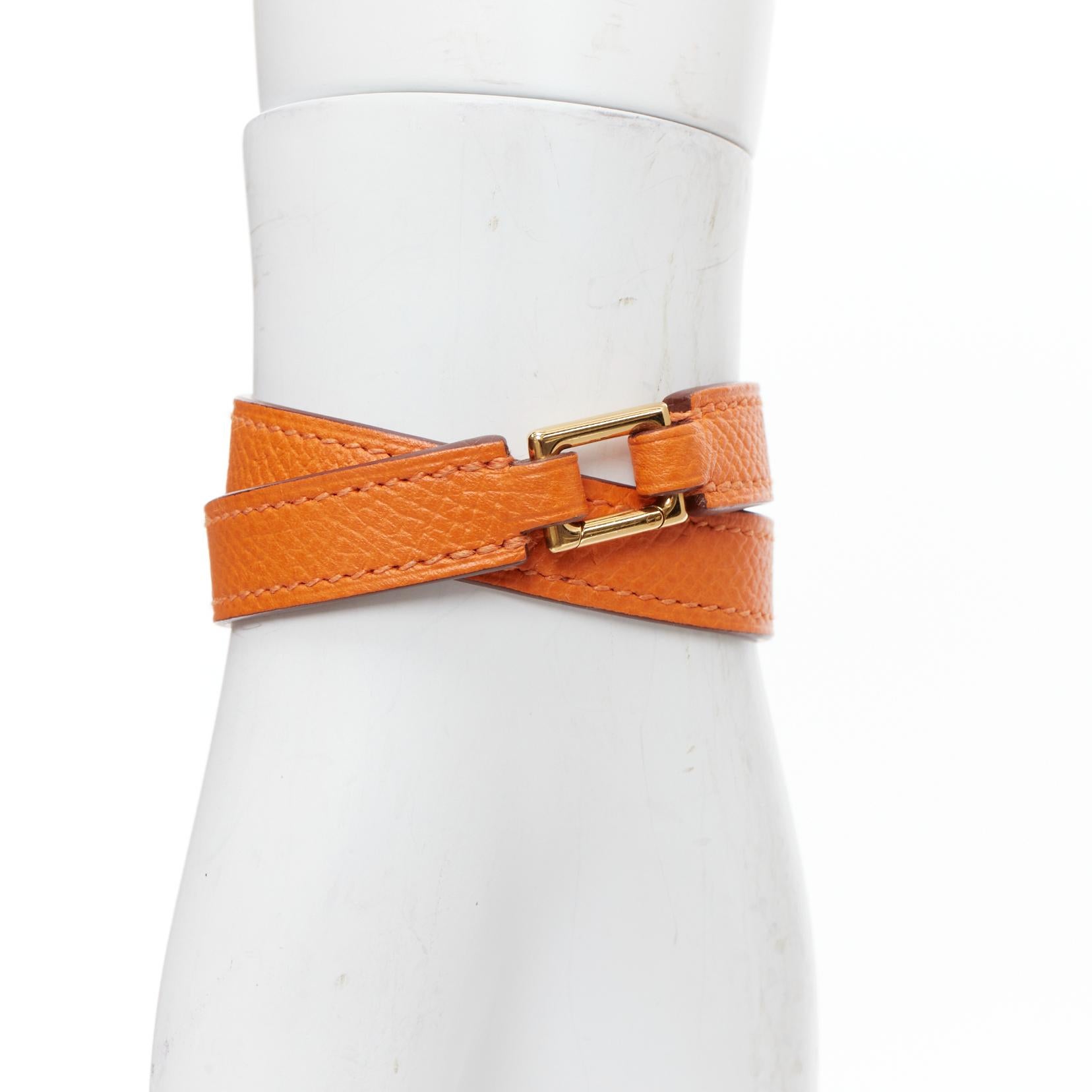 HERMES Rivale Double Tour ange GHW studded double wrap bracelet XS
Reference: VACN/A00069
Brand: Hermes
Model: Rivale Double Tour bracelet
Material: Leather, Metal
Color: Orange, Gold
Pattern: Solid
Closure: Loop Through
Lining: Tan Brown