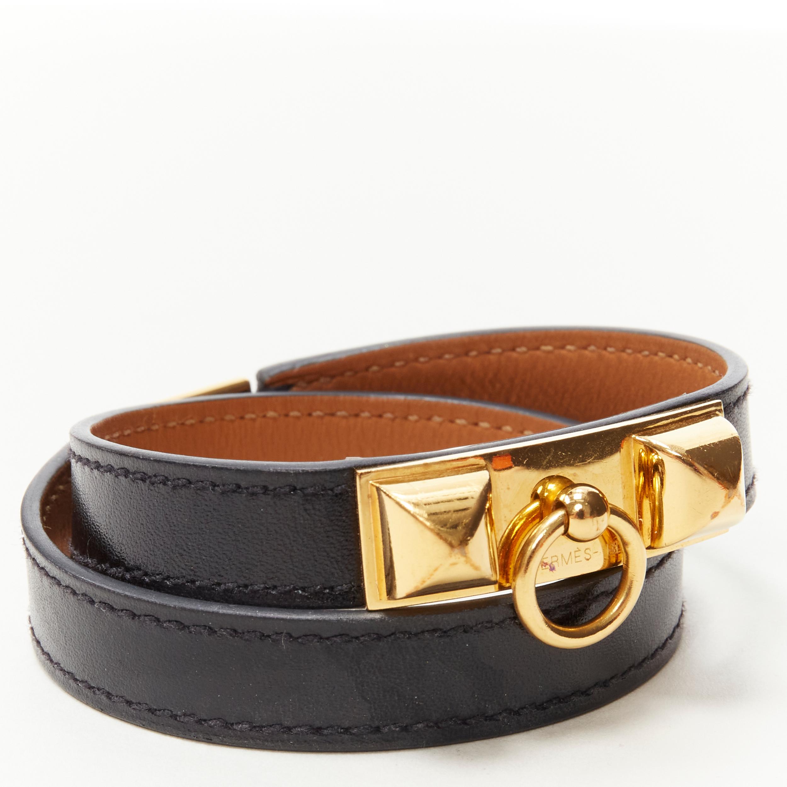 HERMES Rivale Double Tour GHW gold Collier stud black leather wrap bracelet 
Reference: KEDG/A00012 
Brand: Hermes 
Material: Leather 
Color: Black 
Pattern: Solid 
Closure: Clasp 
Extra Detail: 18k yellow gold-plated brass. Black leather. 
Made in: