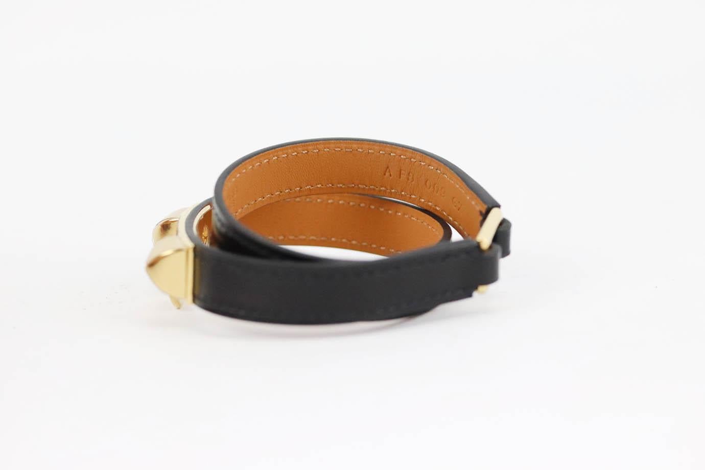 Hermès Rivale double tour leather bracelet. Black. Buckle fastening at back. Protective plastic attached. Comes with box and dustbag. Size: T3 (Circumference: 16.5 cm)
