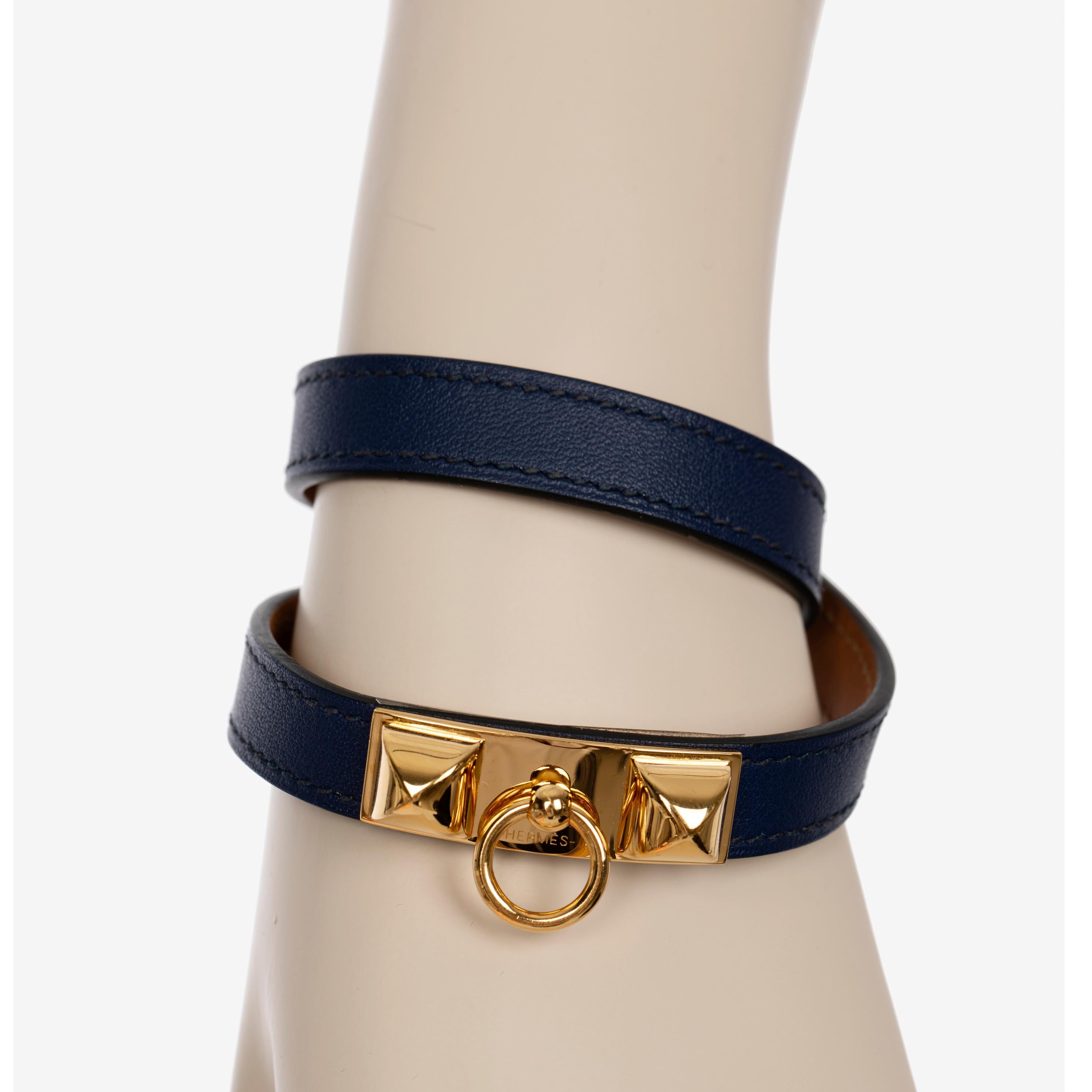 Brand: Hermes

Product: Rivale Double Tour Bracelet

Colour: Navy

Size: Wrist size from 14.5 to 15.5 cm  Width: 12 mm

Year: O  2013

Material: Swift Leather

Hardware: Gold

Condition: Preloved; Very Good

Accompanied By: Hermes Box

Item is in