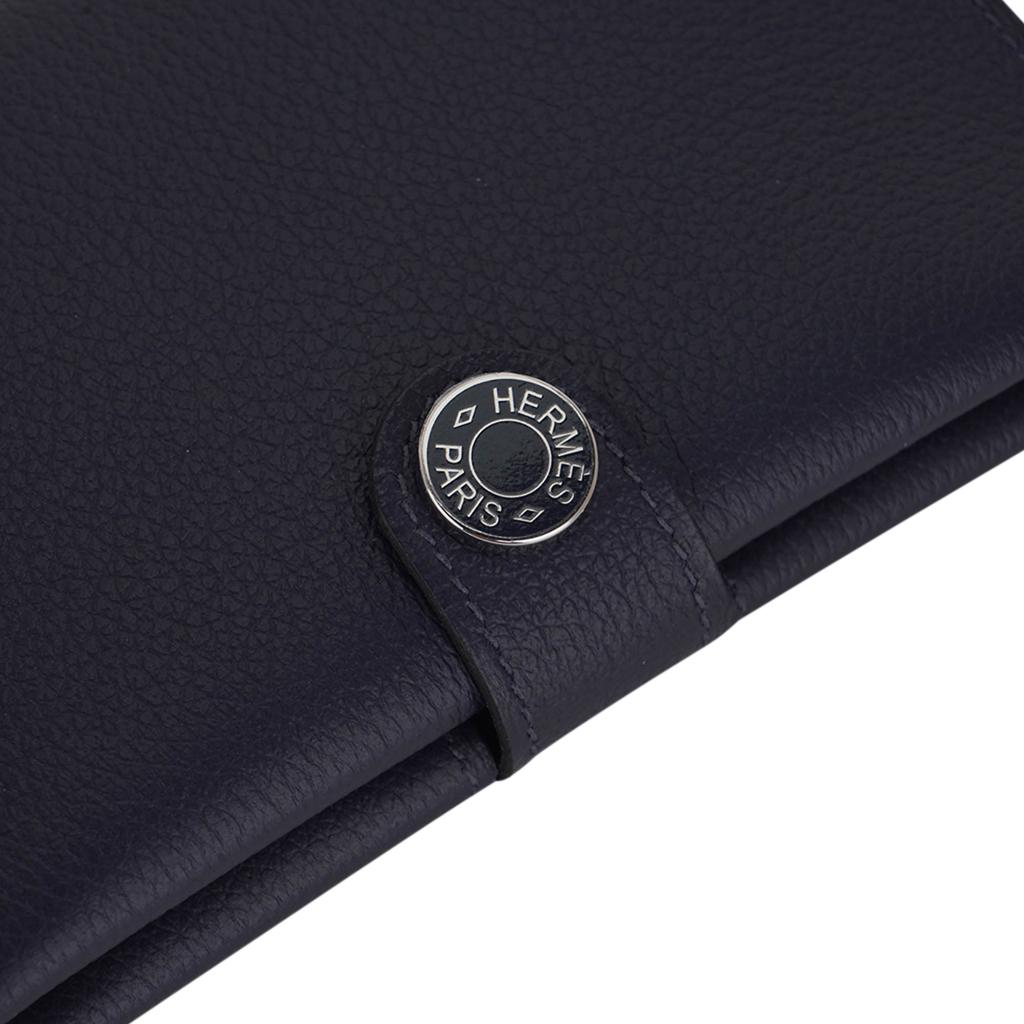 Mightychic offers an Hermes R.M.S. Passport Holder featured in Bleu Nuit.
In beautiful Evercolor calfskin leather - a small, satiny grain with suppleness.
Snap closure with lacquered palladium plated Clou de Selle.
Comes with signature Hermes