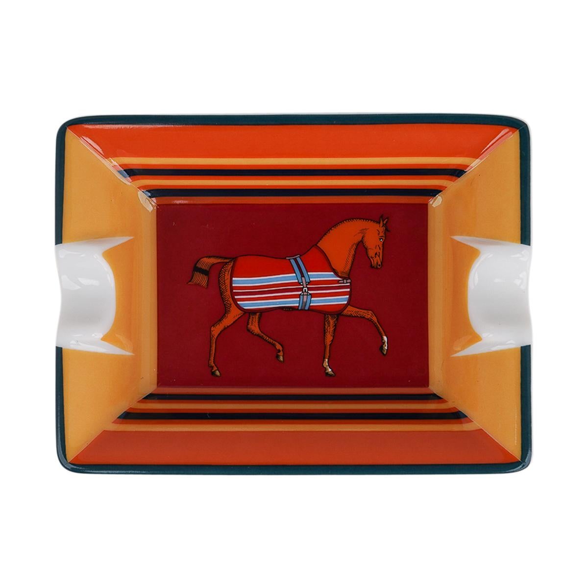 Mightychic offers Hermes Rocabar a Cheval set of two
( 2 ) mini ashtrays.
Rouge H and Terracotta colorway.
A perfect accent piece for any room.
Protected by a velvet goatskin base.
Wonderful for desk or gifting.
Comes with the signature Hermes