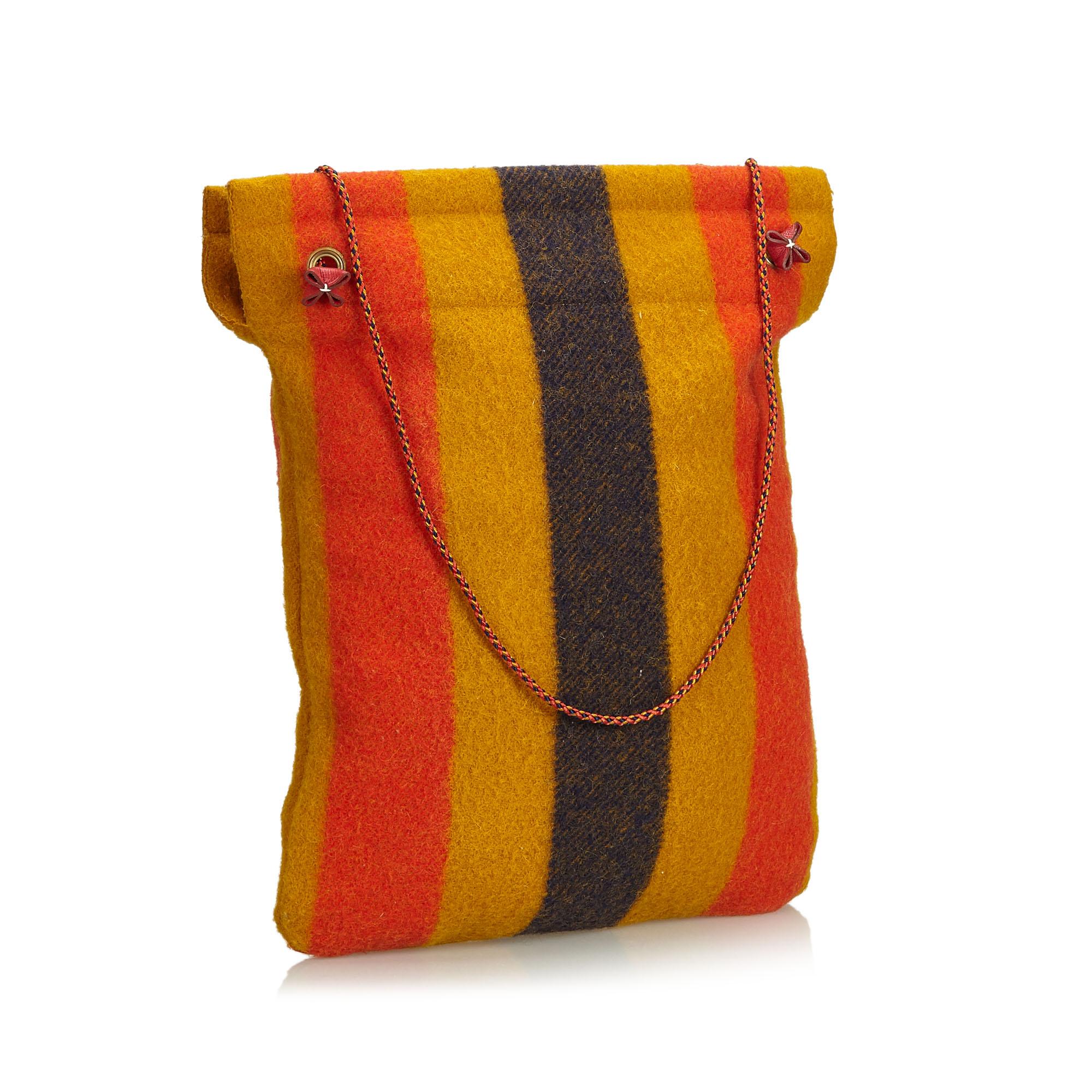 Hermes Rocabar Aline striped wool Grooming Bag 

- gold-plated hardware
- dual multicolour braided rope 
- shoulder straps
- tonal wool interior
- open top

Item authenticated by HEWI London.Â 

Please kindly contact admin with any questions and a