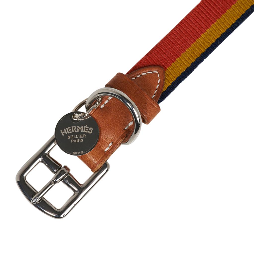 Guaranteed authentic Hermes Rocabar dog collar featured in the medium size.
Collar features signature Rocabar with iconic Hermes colours.
Buckle is stirrup shaped. 
D ring for a leash. 
Bride leather with bone top stitch. 
2cm Silver plated