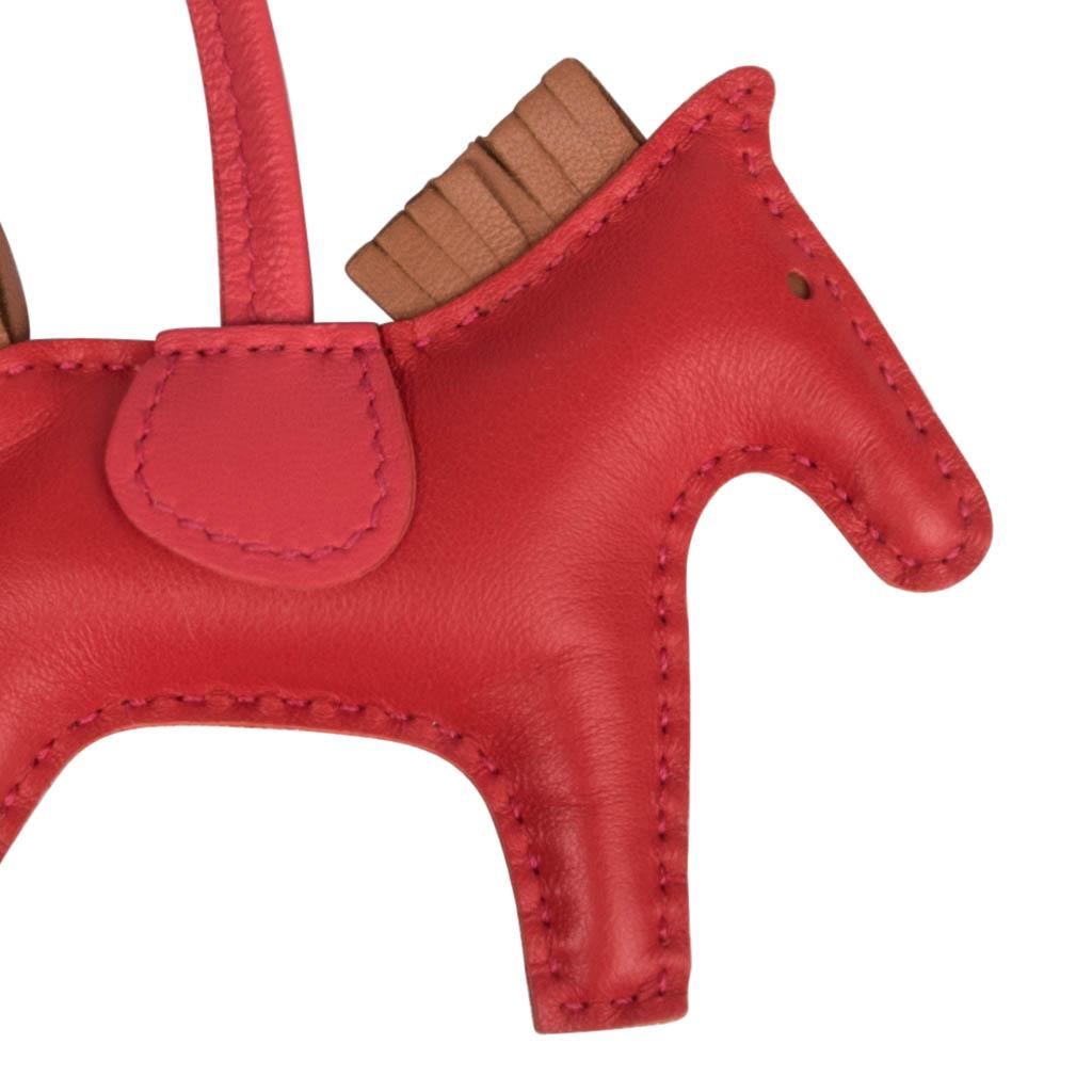 Guaranteed authentic coveted Hermes PM Rodeo bag charm in Rouge Indienne, Bouganvillea and Gold.
Charming and playful she easily adorns a myriad bag colours in your fabulous collection. 
Skin is Milo lambskin.
Signature HERMES PARIS MADE IN FRANCE
