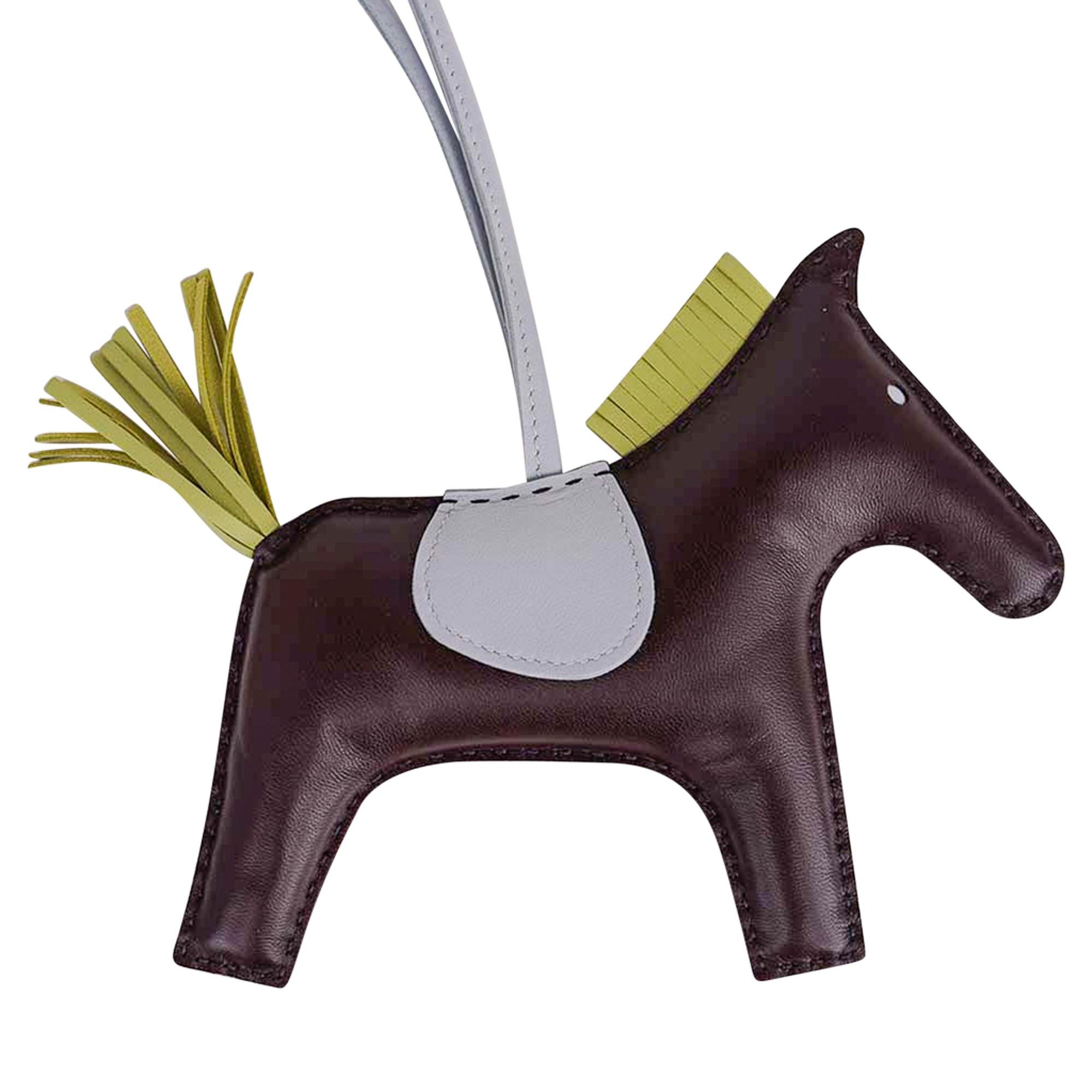 Mightychic offers a guaranteed authentic Hermes Grigri Rodeo GM horse bag charm featured in Rouge Sellier, Bleu Brume
and Jaune Bourgeon.
Charming and playful she easily adorns a myriad of bag colors in your fabulous collection.
Skin is lamb