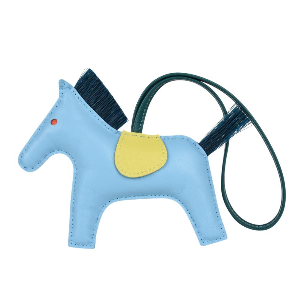Guaranteed authentic Hermes Limited Edition Rodeo MM horse bag charm with genuine horsehair tail and mane
Body is Blue Celeste with Lime saddle and Malachite tail and mane.
Skin is lamb Milo.  
Signature HERMES PARIS MADE IN FRANCE is stamped under