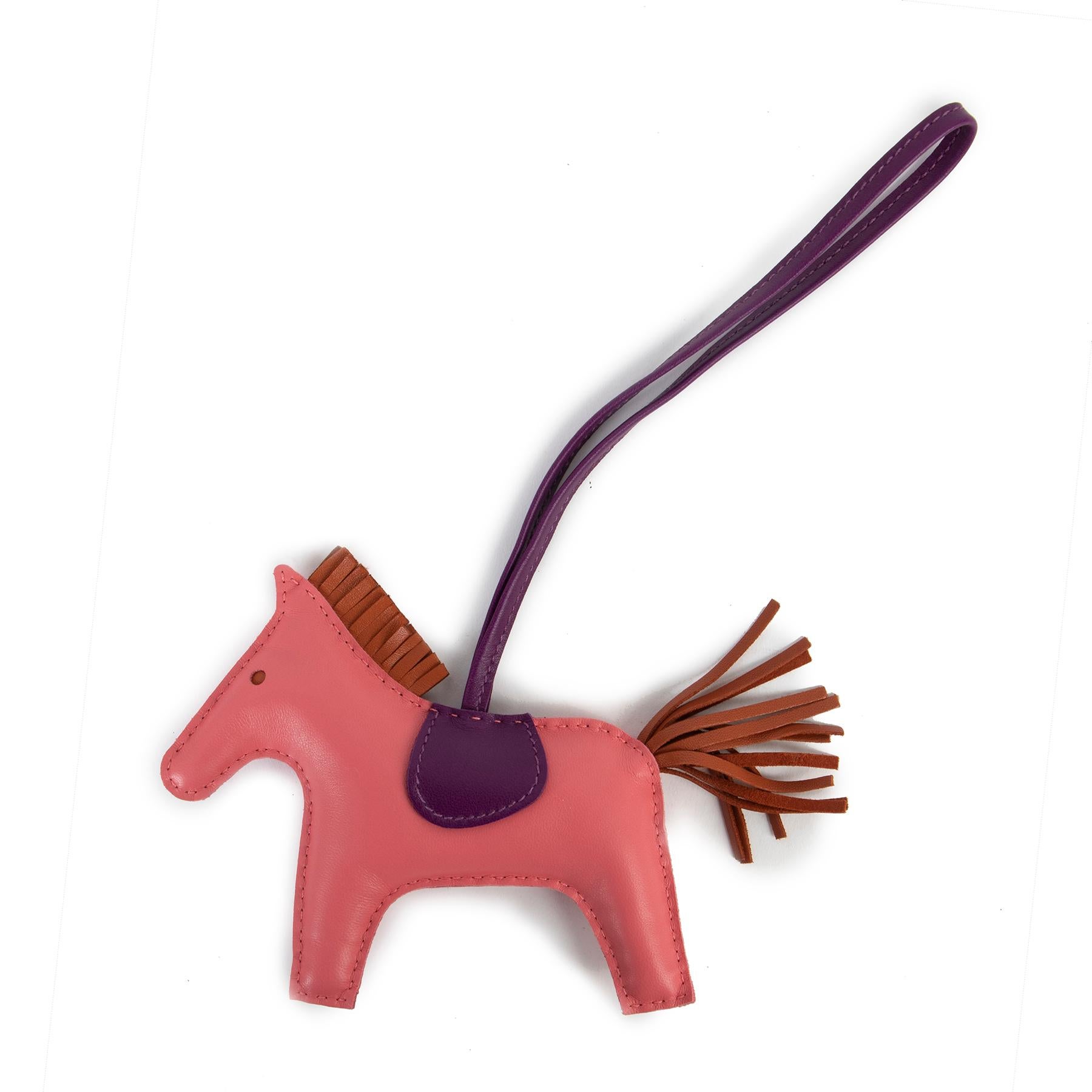 Hermès Rodeo MM Rose Azalee/Malta Blue/Cornelian Bag Charm

A lovely collector's item from Hermès, this Rodeo MM horse bag charm is perfect for pimping up any handbag. Made from soft lambskin in a combination of Rose Azalee pink, Malta Blue and