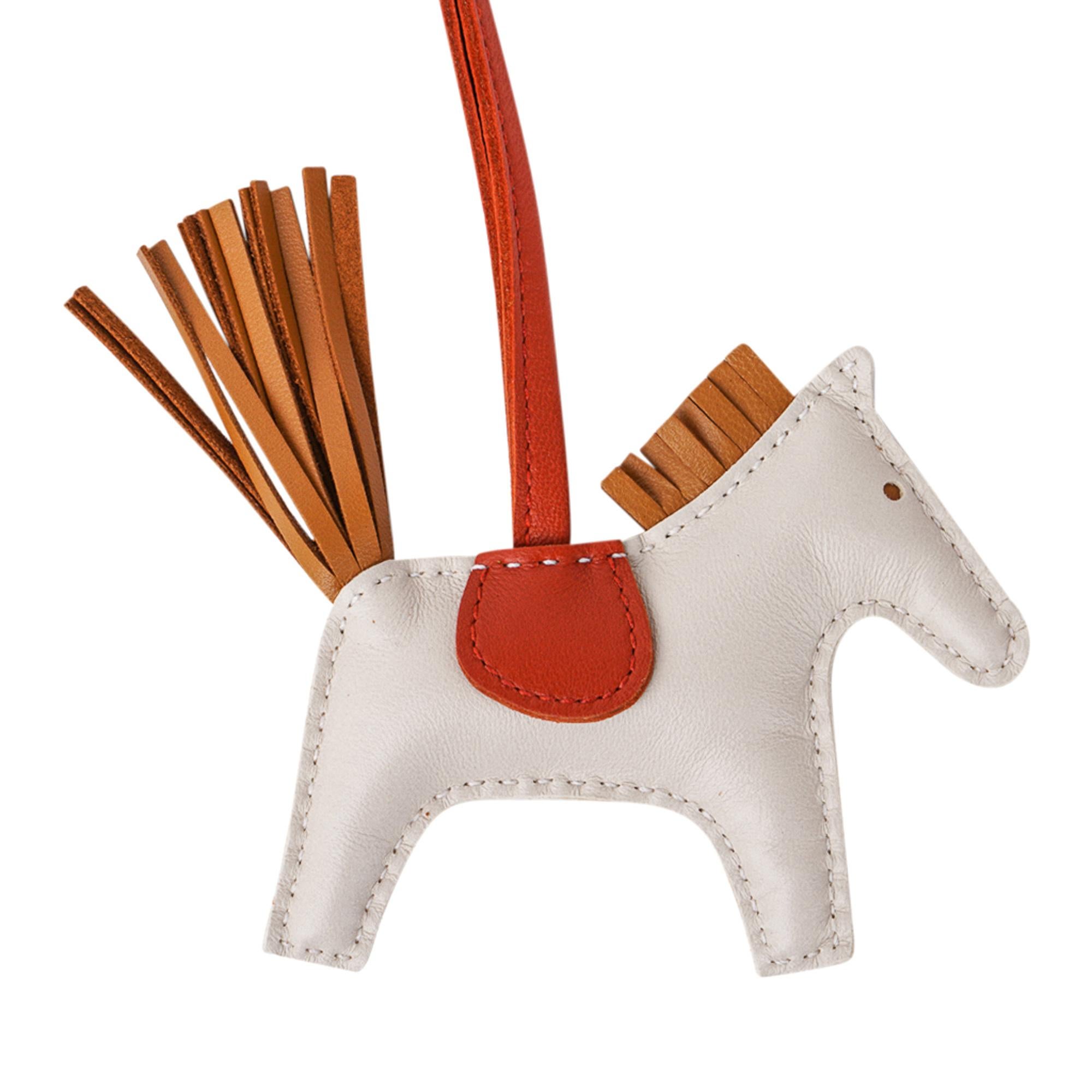Mightychic offers an Hermes PM Rodeo bag charm featured in Craie, Sesame and Cornaline.
Charming and playful she easily adorns a myriad bag colours in your fabulous collection.
Skin is Milo lambskin.
Signature HERMES PARIS MADE IN FRANCE is stamped